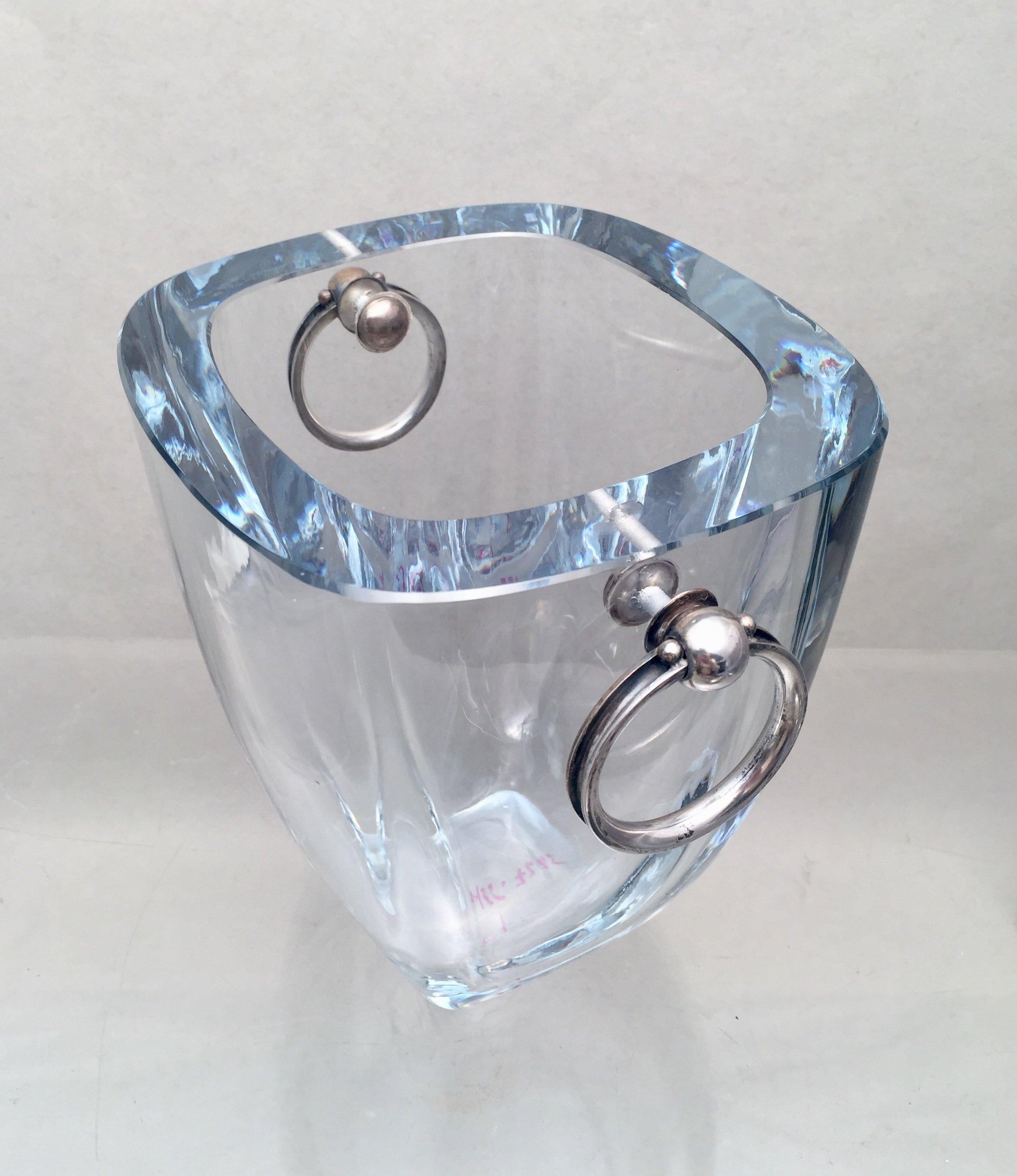 Beautiful crystal ice bucket with a slight blue hue and sterling silver circular handles by Dansk Guldsmede Handvaerk. Bucket measures 6 1/4 inches tall and 6 1/2 inches from handle to handle. Bearing hallmarks. Perfect for bar use. 

