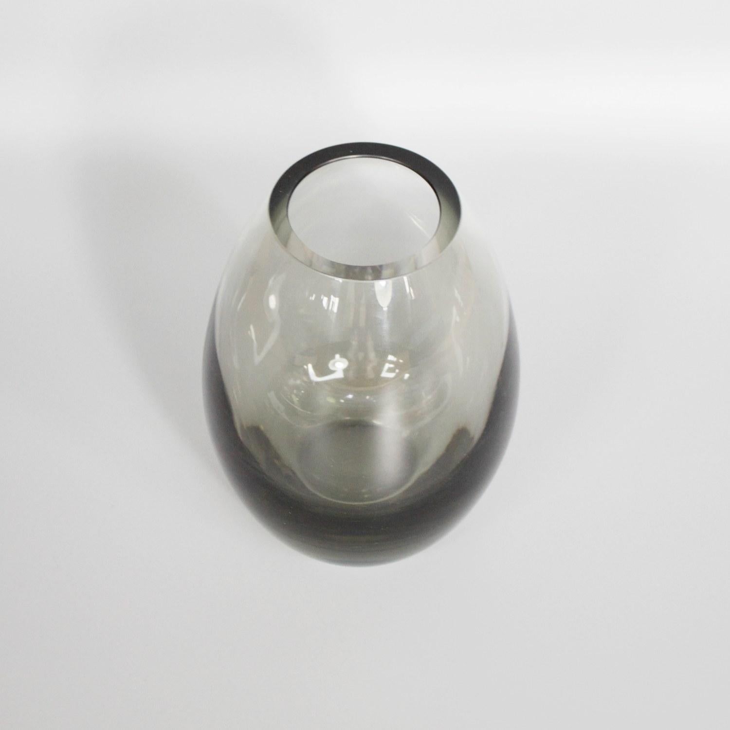 A clear and black glass vase by Danish glassmaker Per Lütken for Holmegaard Glassworks. Signed and Dated 1961.

Dimensions: H 16cm D at top 7.5cm

Origin: Danish

Date: 1961

Holmegaard Glassworks is located in the town of Fensmark,