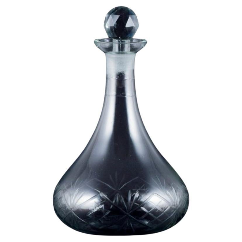 Danish glasswork, wine decanter in clear glass. Ball-shaped faceted stopper. For Sale