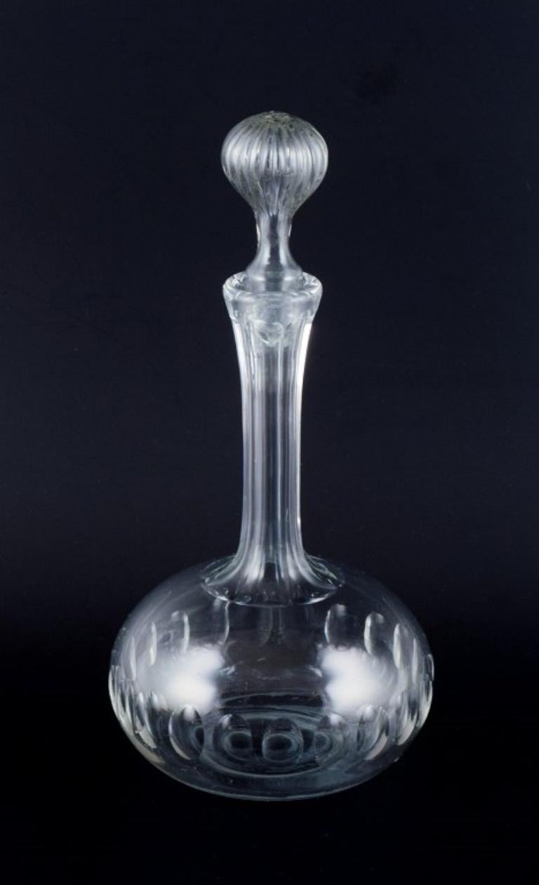 Danish glasswork, wine decanter in clear facet-cut glass.
1930s/1940s.
In excellent condition.
Dimensions: H 29.5 x D 13.0 cm.