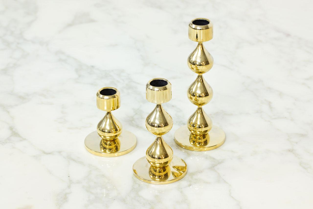 Set of three gold-plated candleholders
designed by Hugo Asmussen, produced by
Asmussen in Denmark during the 1970s
Drop shaped candlesticks with 24–carat
gold plating. Engraved on the bottom.