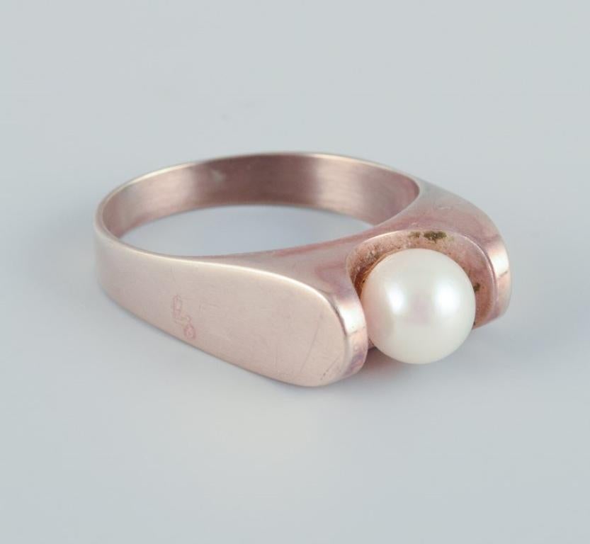 Women's Danish goldsmith, 14 karat gold ring adorned with a cultured pearl.  For Sale