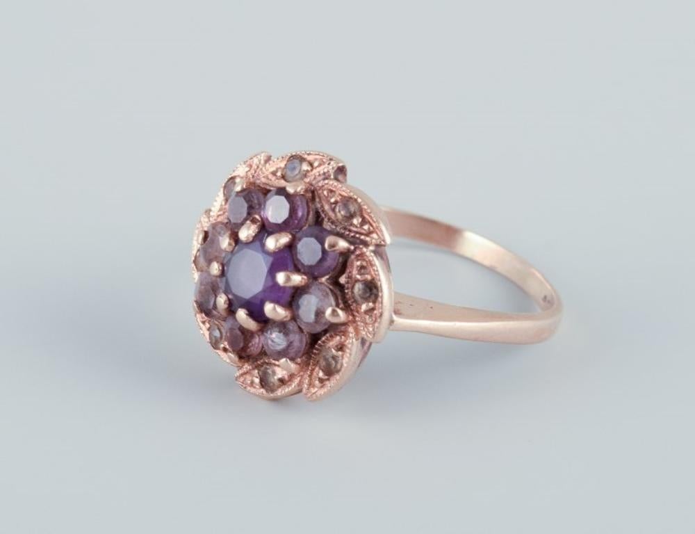 Art Deco Danish goldsmith, 14 karat gold ring adorned with a purple semi-precious stone. 