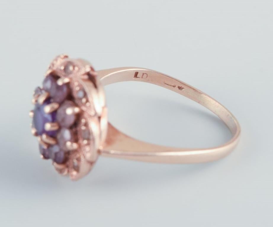 Danish goldsmith, 14 karat gold ring adorned with a purple semi-precious stone.  For Sale 2