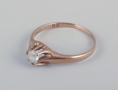 Danish goldsmith. Classic gold ring with a semi-precious stone. Mid-20th C.