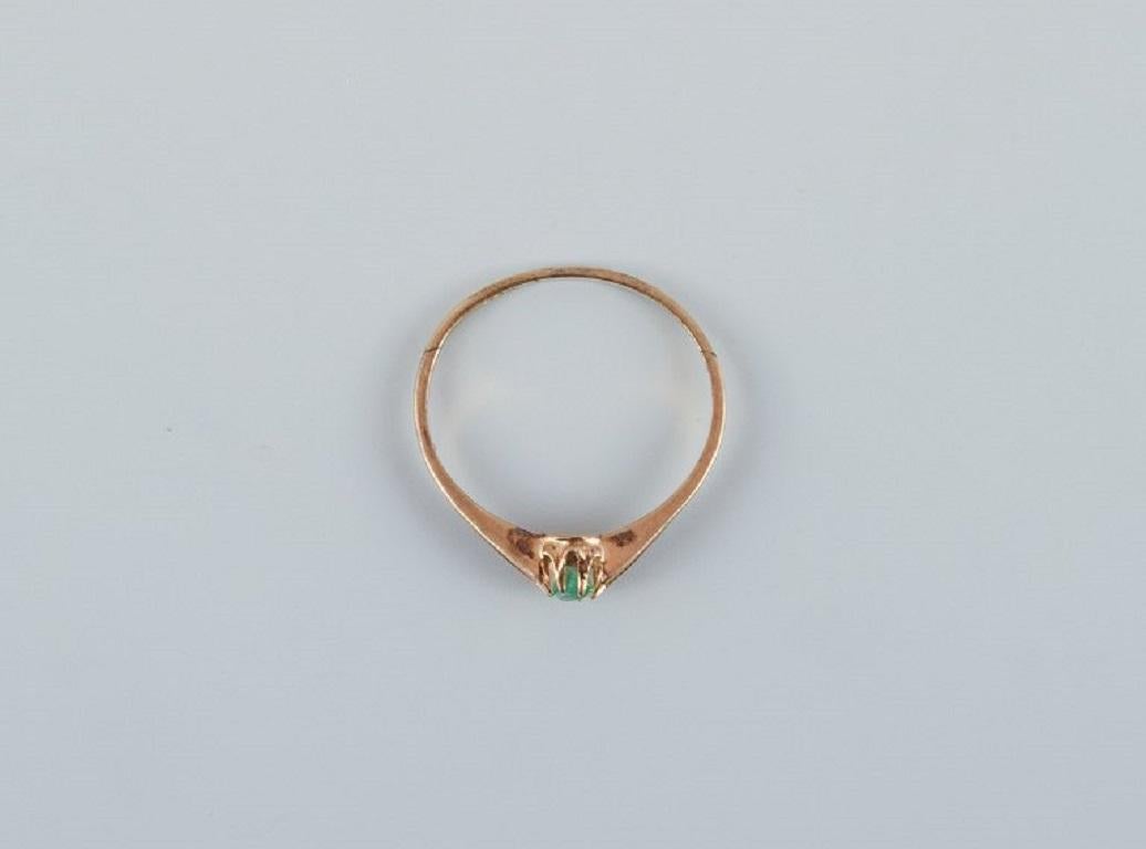 Danish goldsmith. Modernist 14 carat gold ring adorned with a green semi-precious stone, marked with the goldsmith's initials.
Marked 585.
In very good condition.
Ring size 18mm.
US size: 7.75.