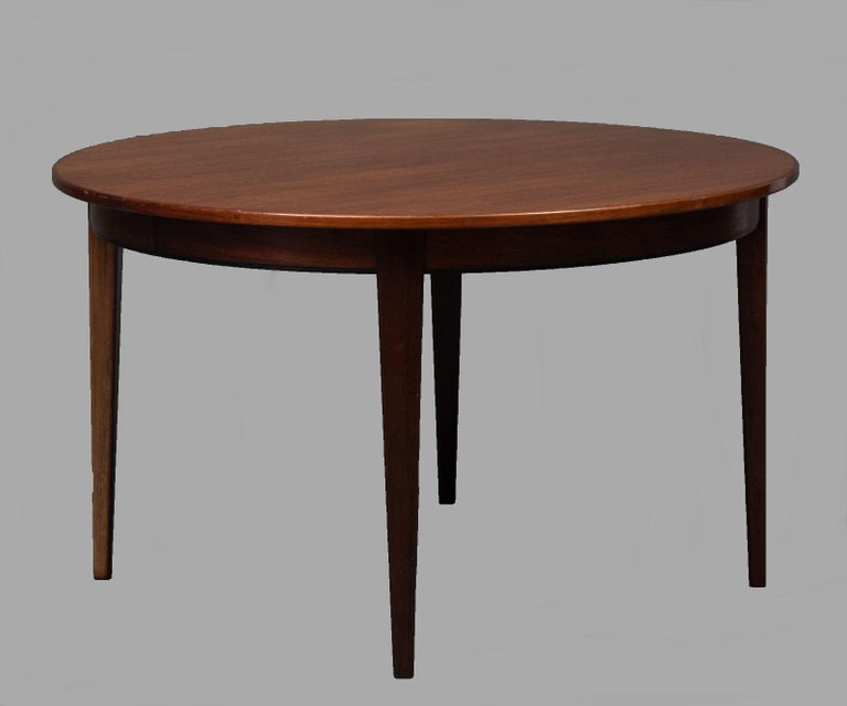 Danish Omann Jun extendable dining table in rosewood.

The well crafted dining table has a simple and elegant design that enhance the pattern of the rosewood. The dining table has three 50 cm. / 19.7 in. extensions all in in rosewood making the