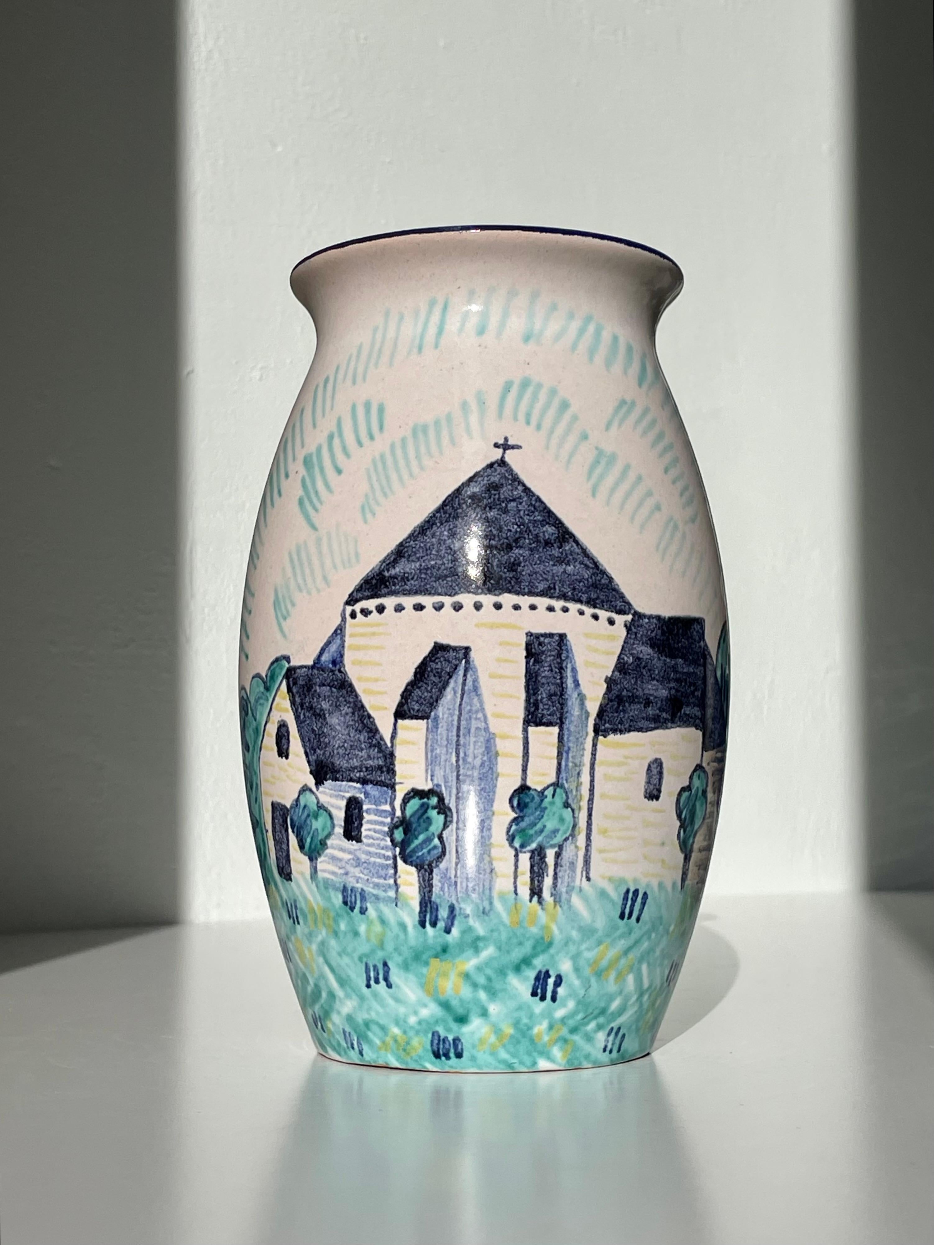 Unusually large piece from Søholm’s series of vases decorated with images of local buildings on the island of Bornholm where Søholm was based. This item depicts one of the four famous white medieval round churches still standing on Bornholm.