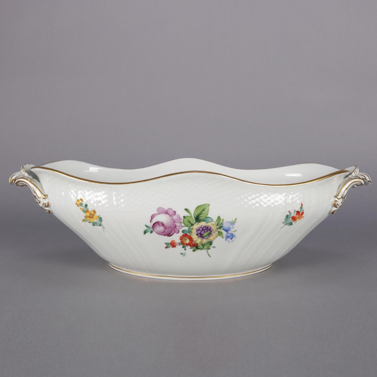Danish Royal Copenhagen porcelain center bowl features scalloped oval form with double handles and decorated with hand-painted floral sprays inside and out, trimmed in gilt, reminiscent of Fora Danica, marked on base as photographed, 20th