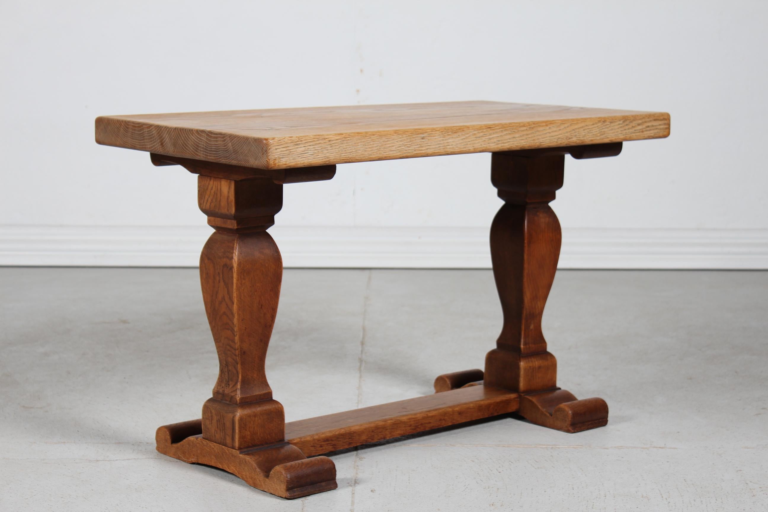 Danish brutalist style side table/coffee table of solid oak with a heavy tabletop on baluster shaped frame.
Handcrafted by a Danish cabinetmaker ca. 1940s. 

The table has got a beautiful patina, the tabletop with a lighter color than the frame