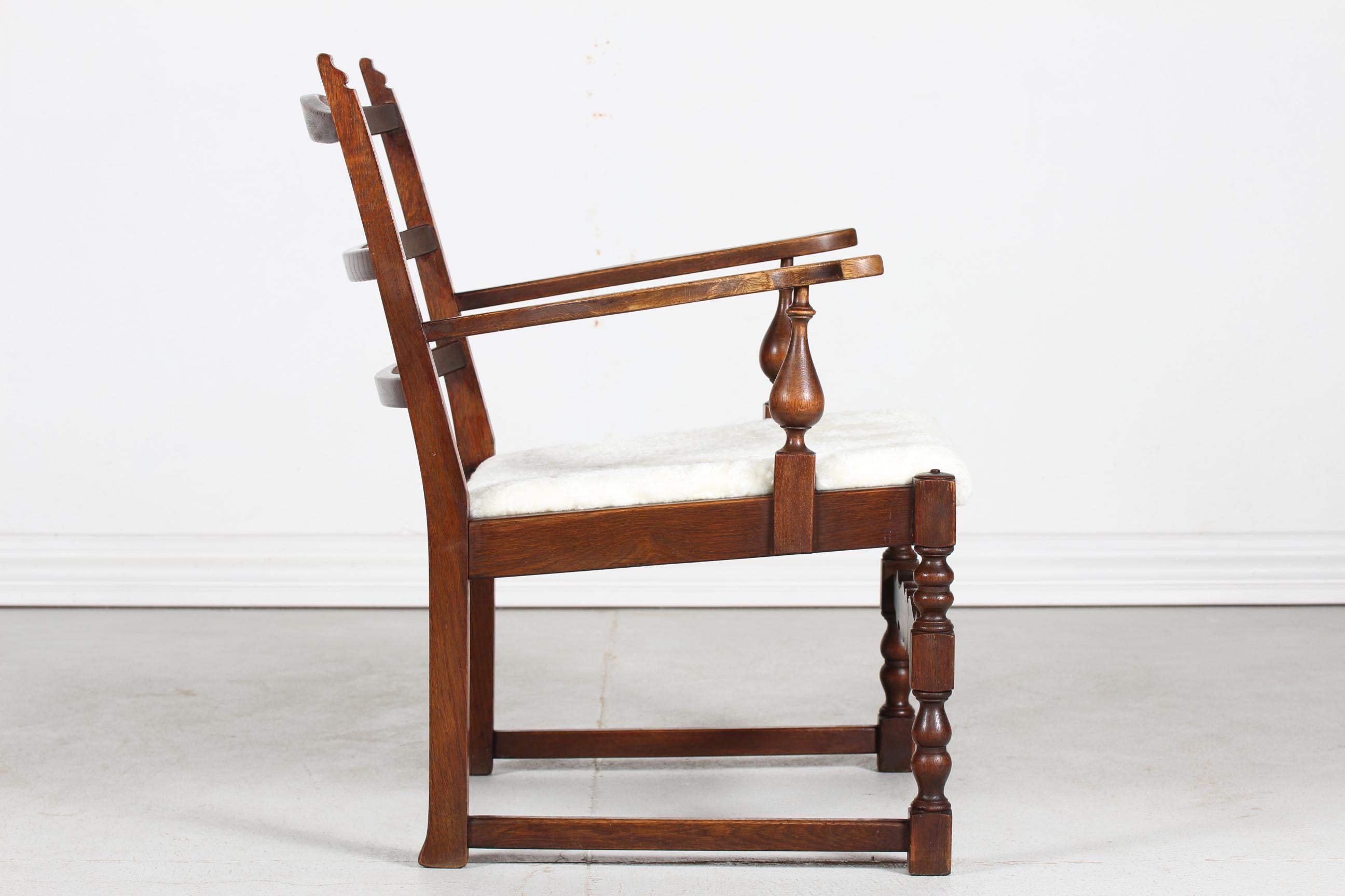 Carved Danish Sculptural Handcrafted Lounge Chair of Solid Oak with Sheepskin 1940s For Sale