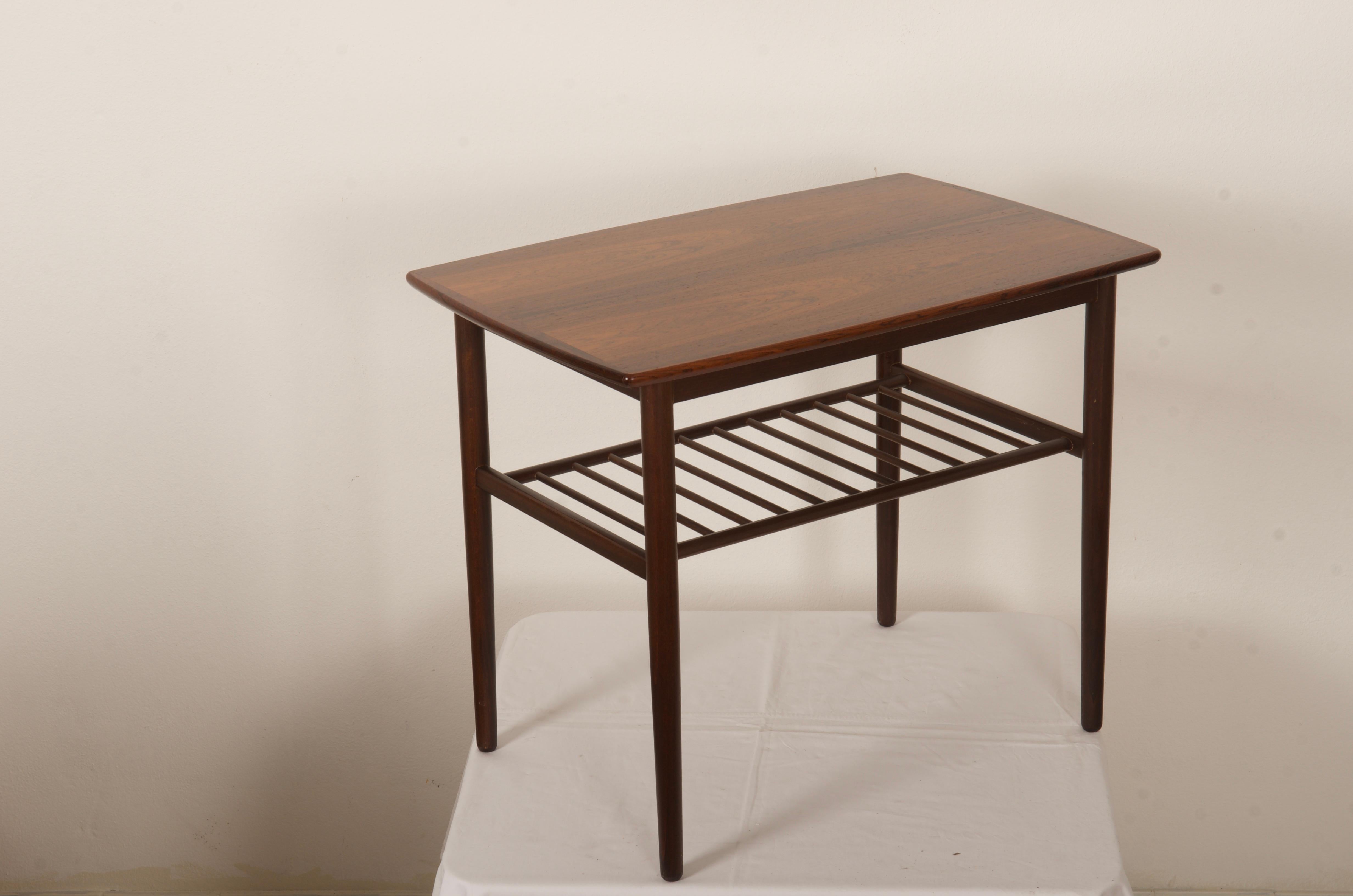 Hardwood side tabel with grid compartment, made in Denmark in the late 1960s.