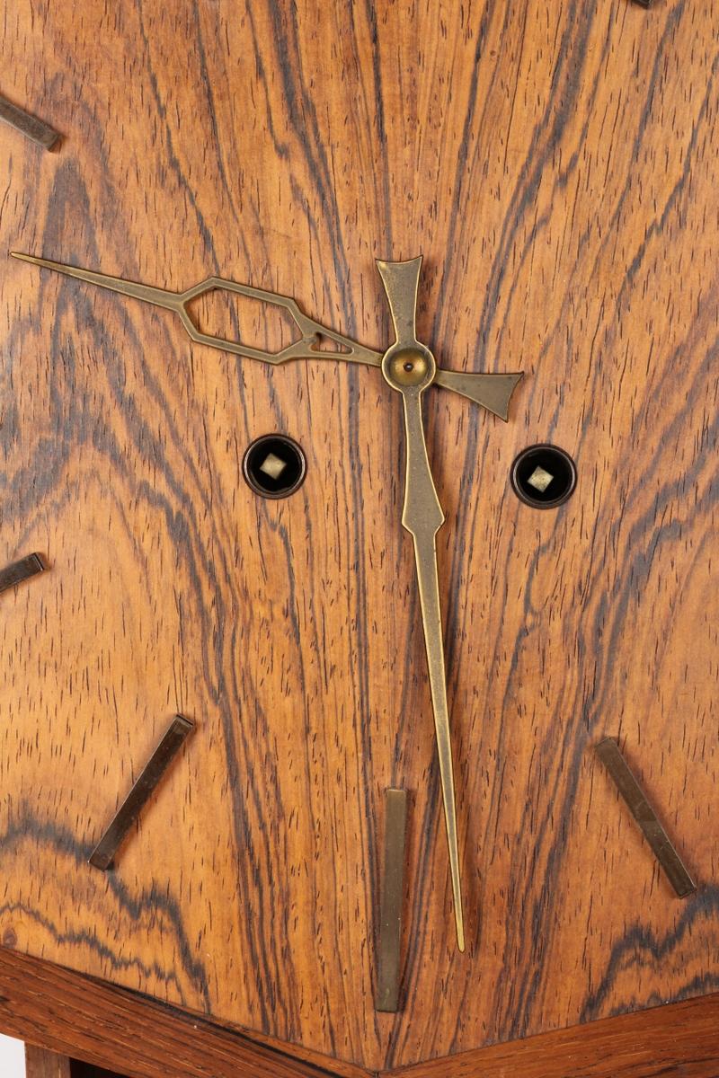Wooden frame with wooden clock face and brass hands and indexing. Made in the 1960s in Denmark 
Perfect original working condition and after a professional revision.