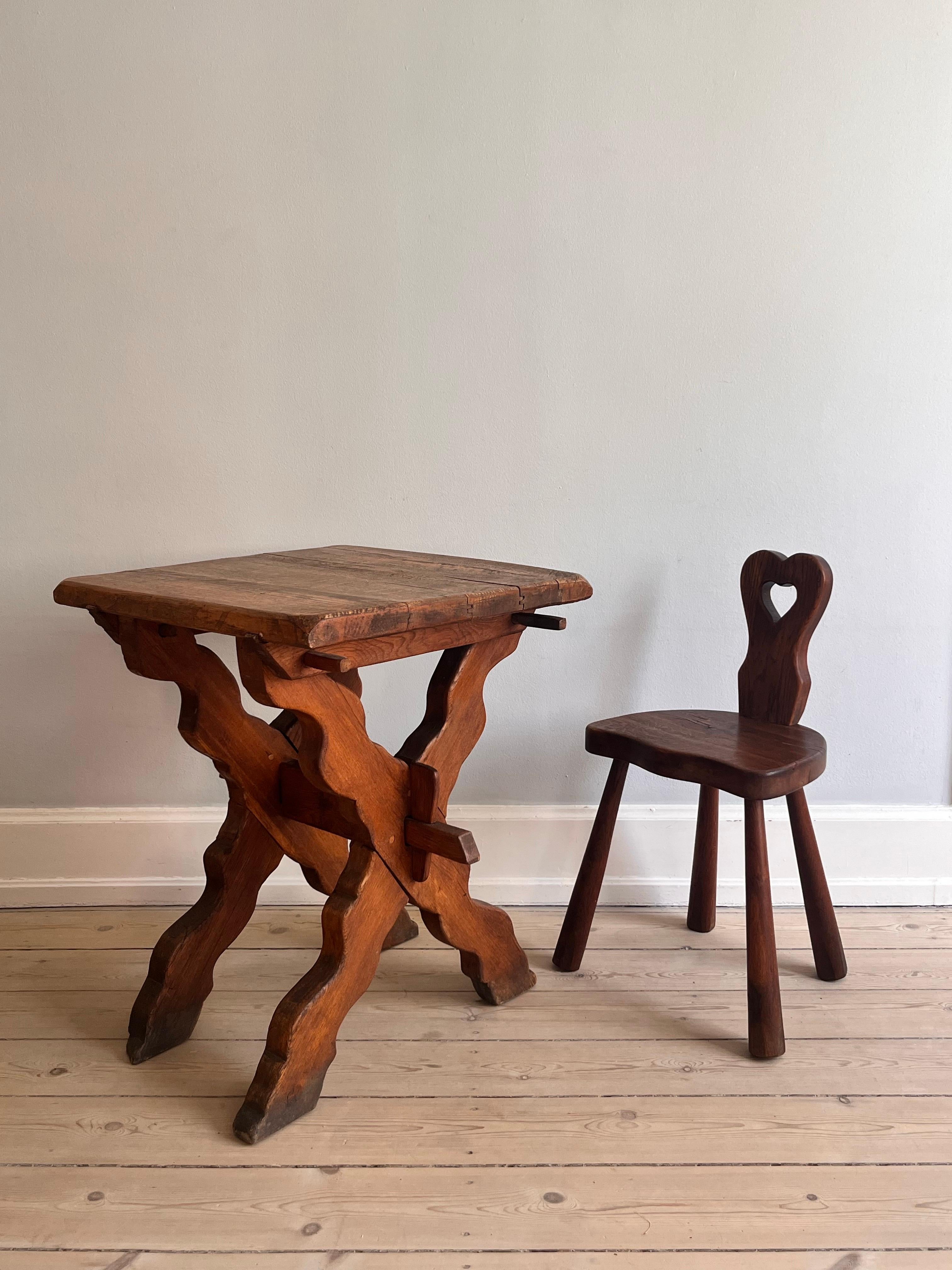 This chair is made of solid oak with rounded, chunky club legs. 

The chair is ca. from the 1920s with a characteristic back shaped like a heart. 

Decorative and unique.