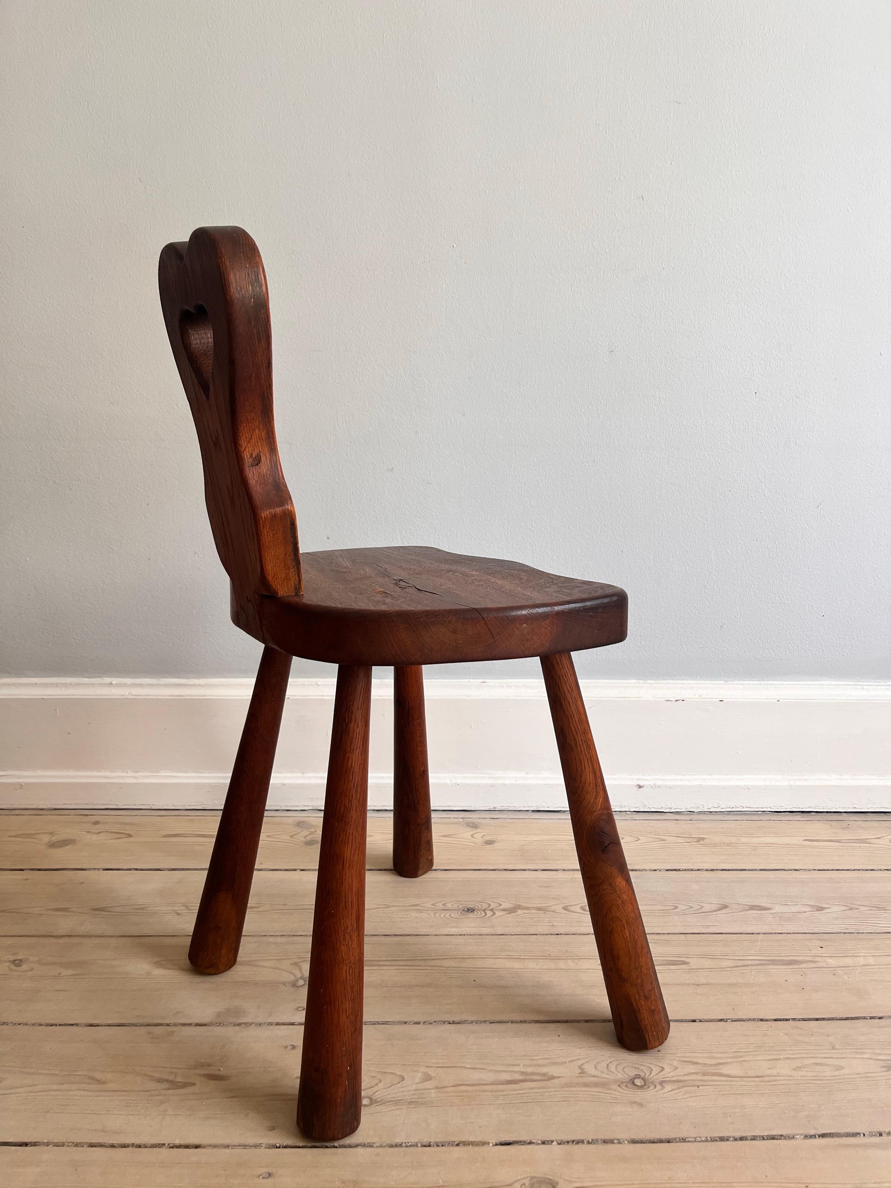 Hand-Carved Danish heart-shaped folk chair from the 1920s For Sale