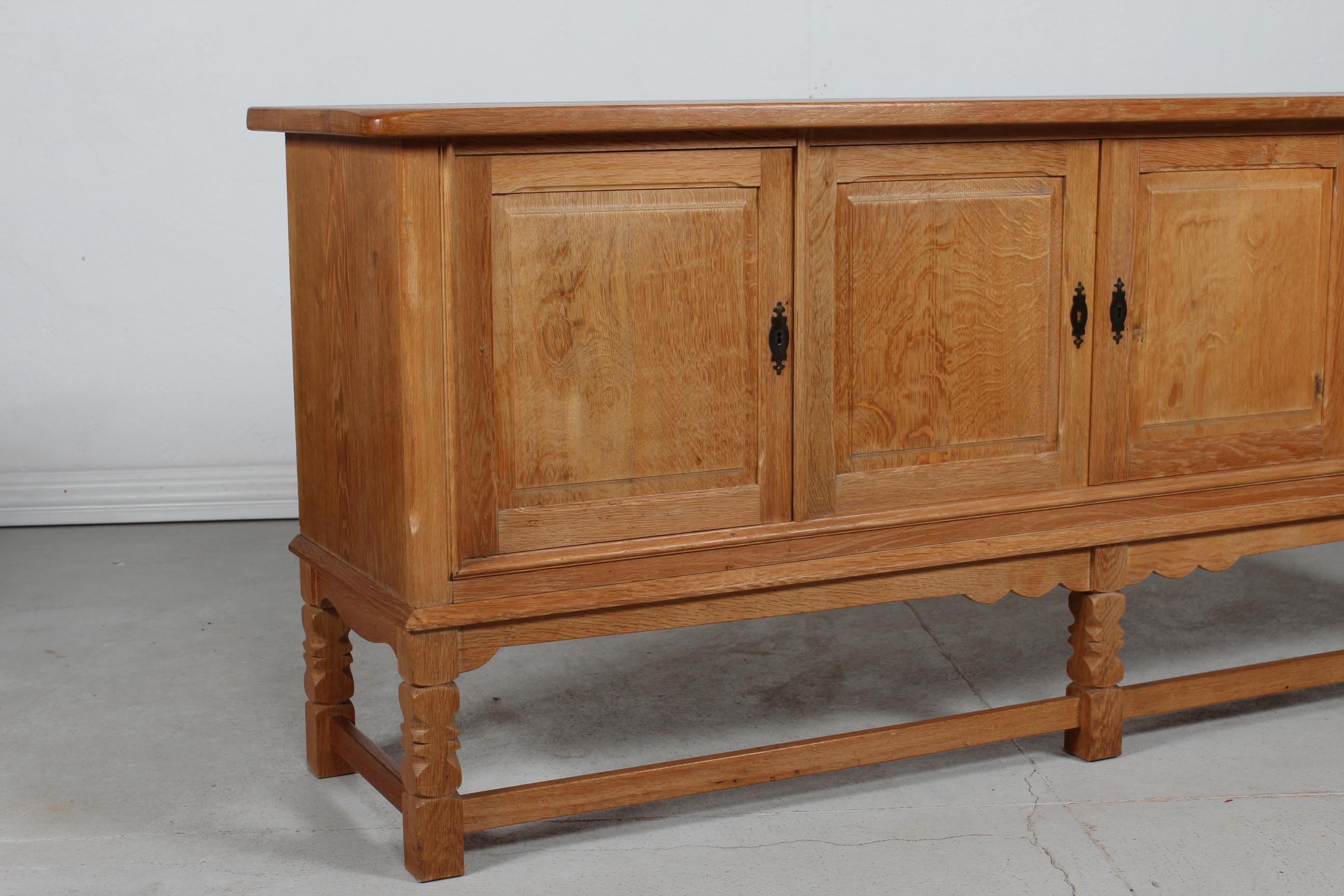 Late 20th Century Danish Henning Kjærnulf attr. Long Sideboard of Solid Oak with 4 Doors 1970s For Sale