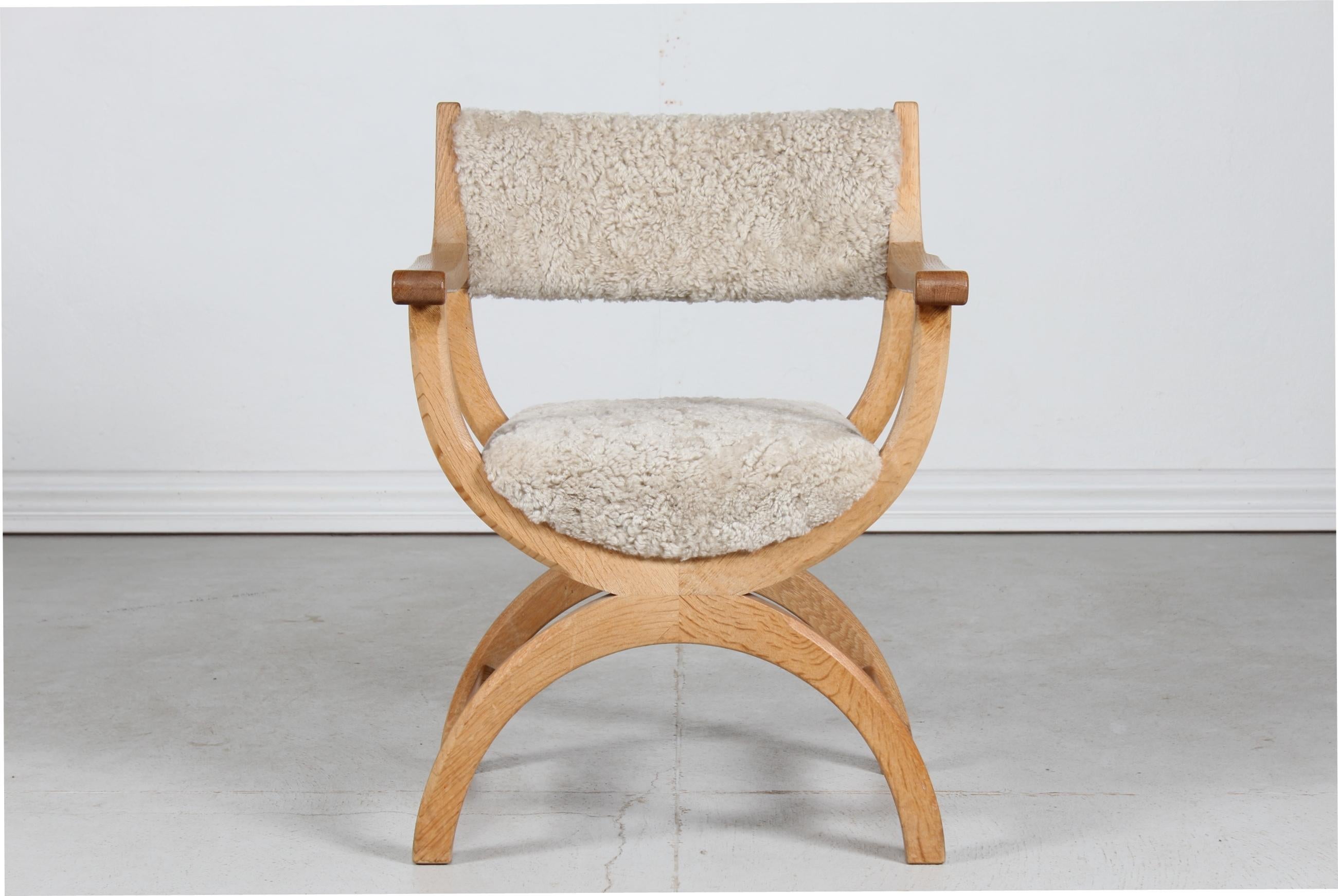 Danish vintage Henning Kjærnulf kurul chair and armchair manufactured by EG Møbler in Denmark

The chair is made of solid oak upholstered with new sheepskin which is very comfortable and hyggeligt to sit on.

Very nice vintage condition with gentle