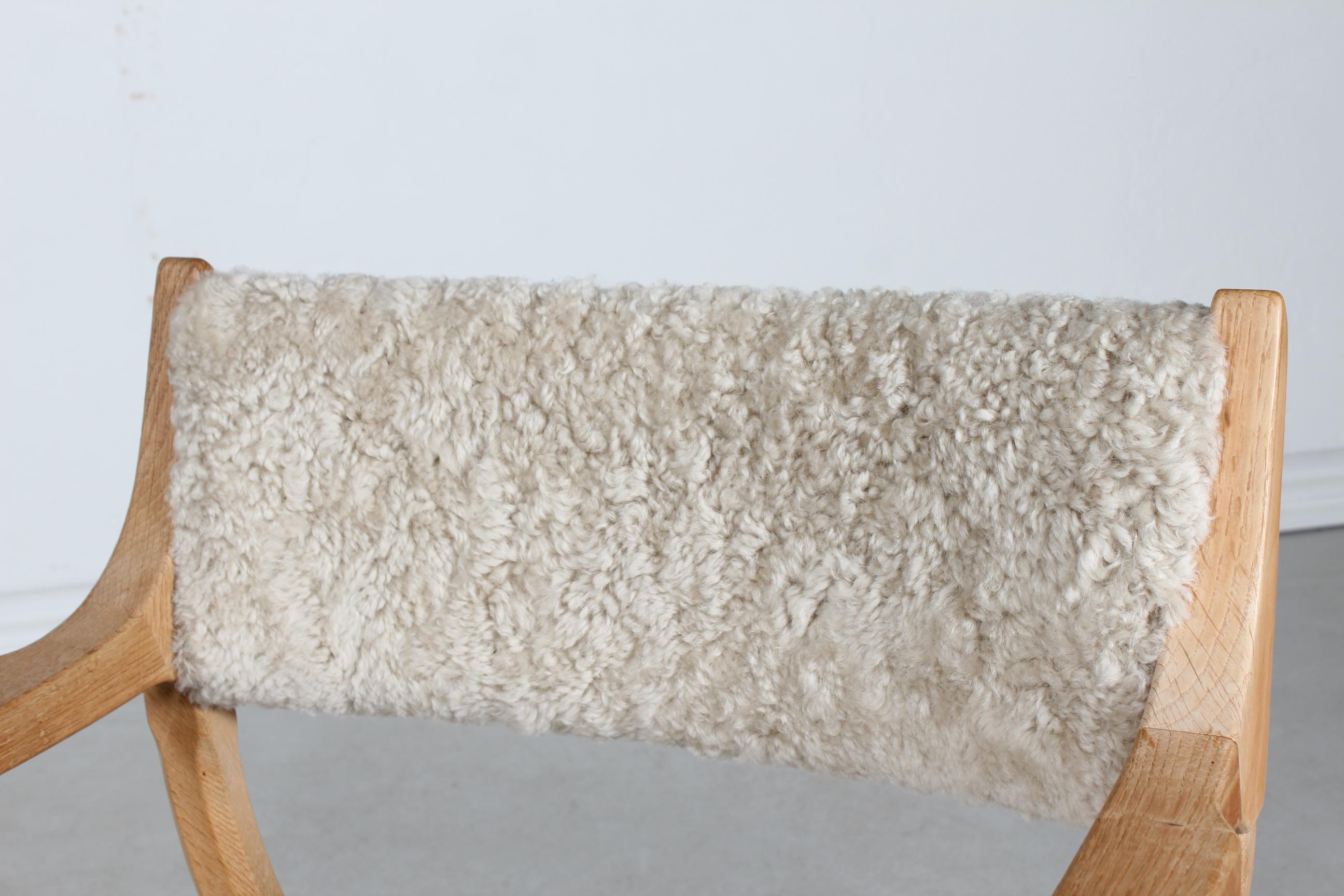 Sheepskin Danish Henning Kjærnulf Kurul Chair by EG Møbler of Solid Oak + Sheep Skin 1970