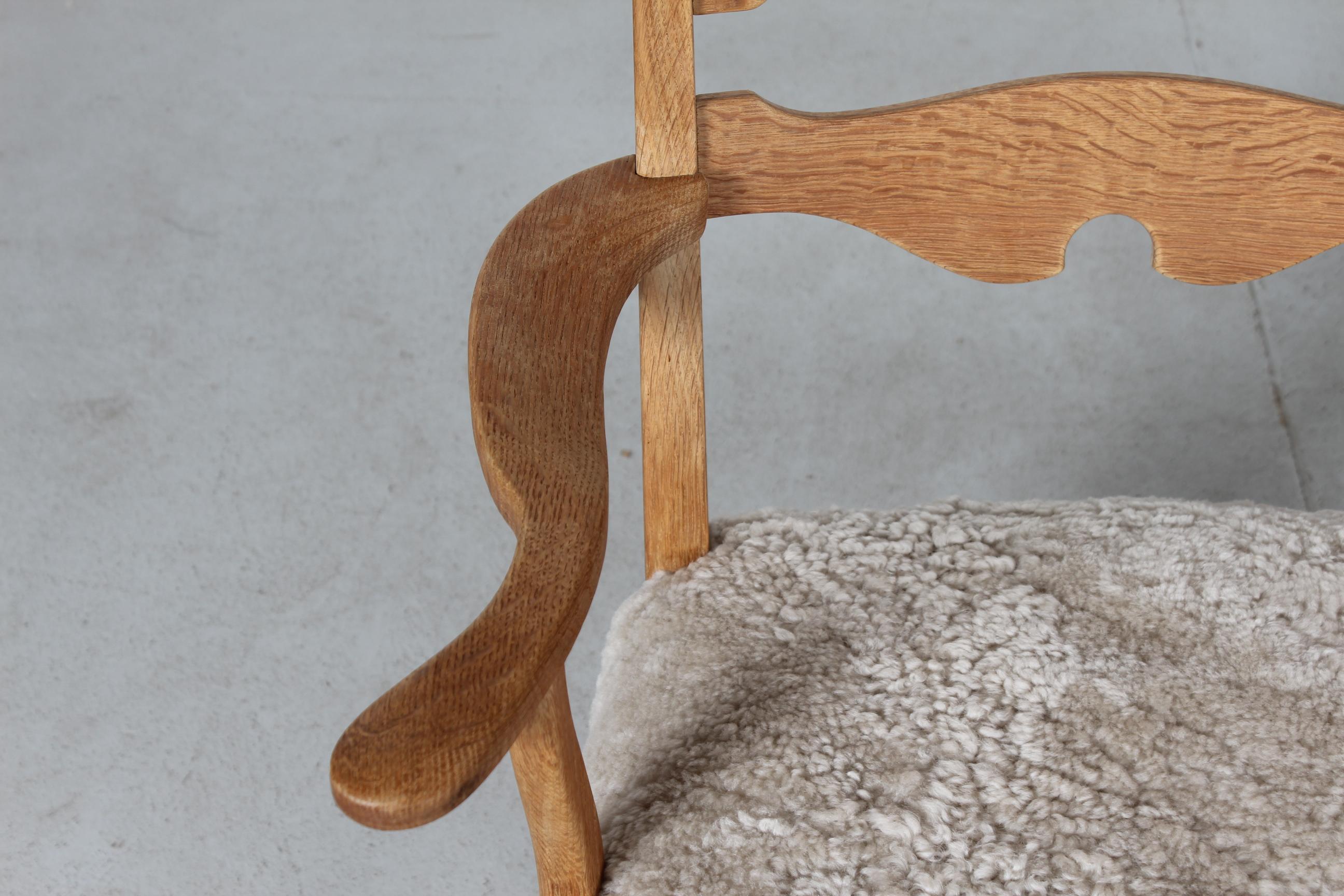 Late 20th Century Danish Henning Kjærnulf Pair Razor Blade Armchairs of Solid Oak with Sheep Skin