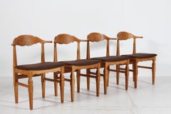 Dänischer Henning Kjærnulf Satz von 4 Esszimmerstühlen aus massiver Oak von E G Møbler 1970s