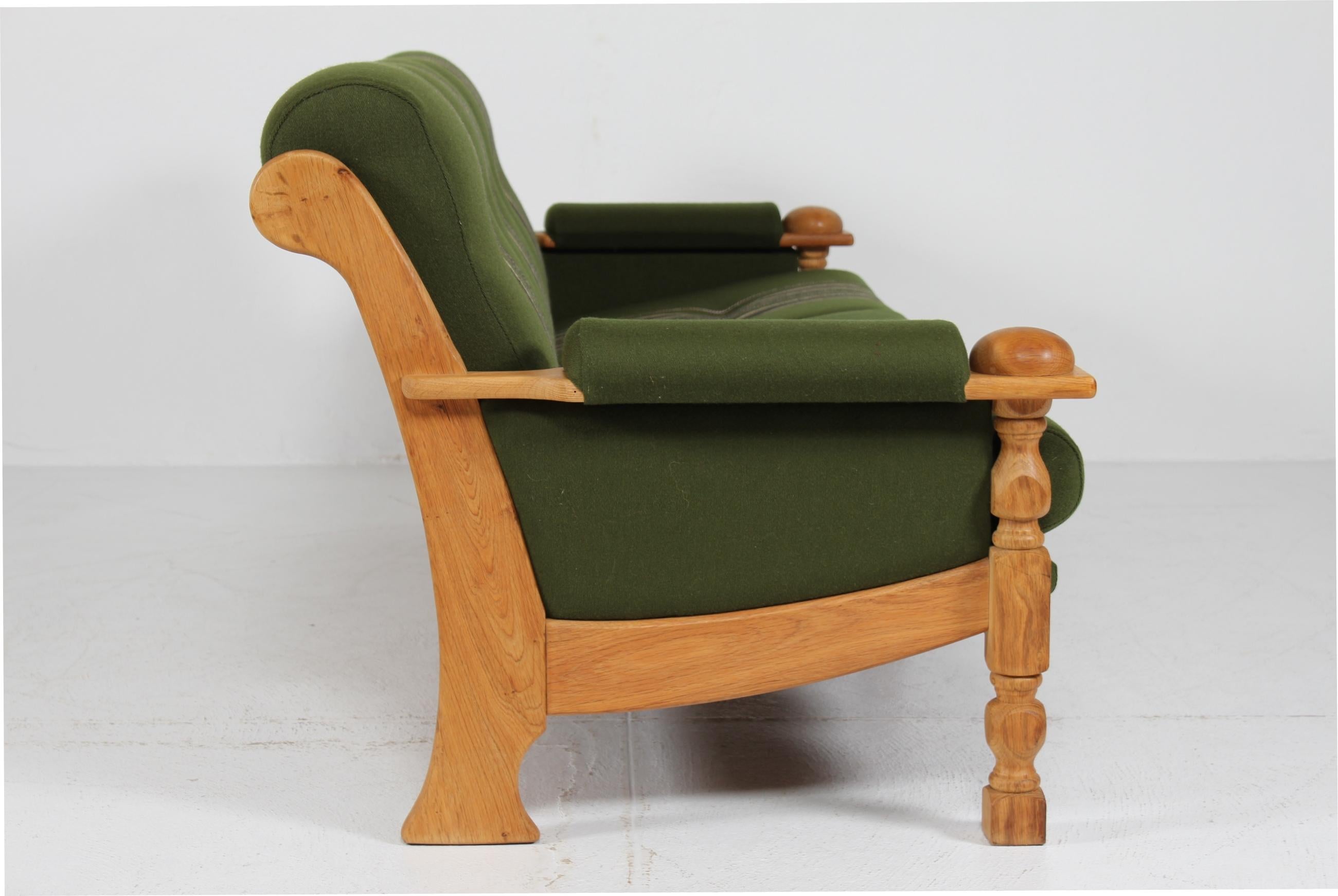 Turned Danish Henning Kjærnulf Sofa of Solid Oak with Original Green Striped Wool 1970s