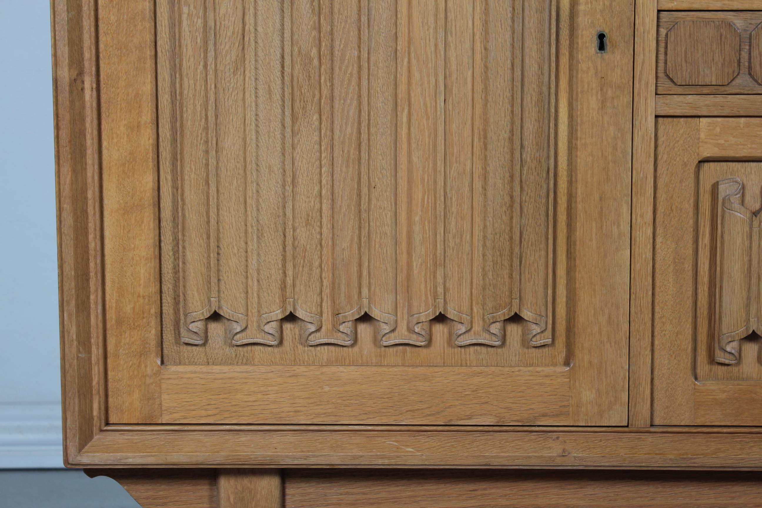 Danish Henning Kjærnulf style Long + High Sideboard of Solid carved Oak 1970s 5