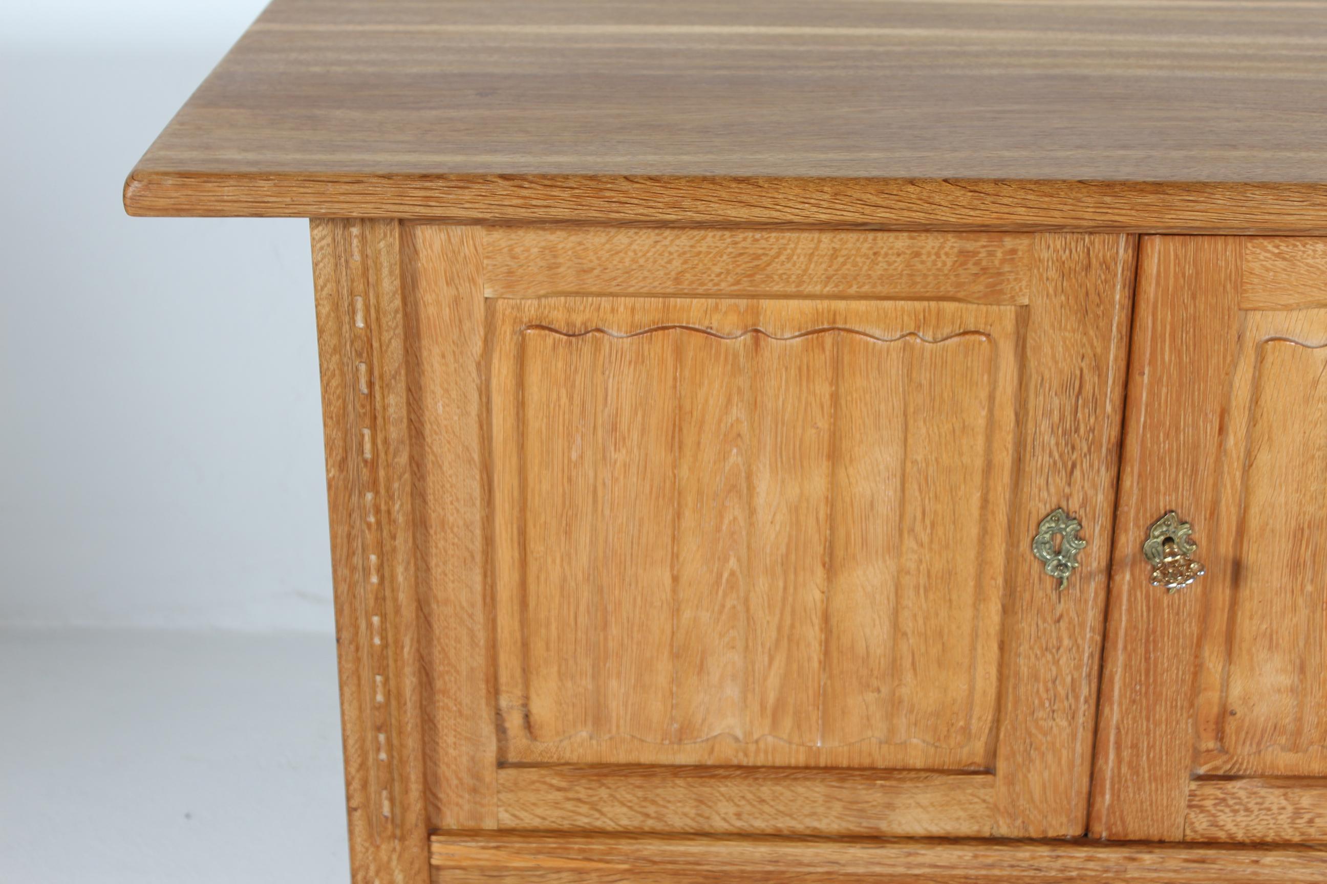 Woodwork Danish Henning Kjærnulf style Long Sideboard of Oak with 4 Doors Brutalist 1970s For Sale