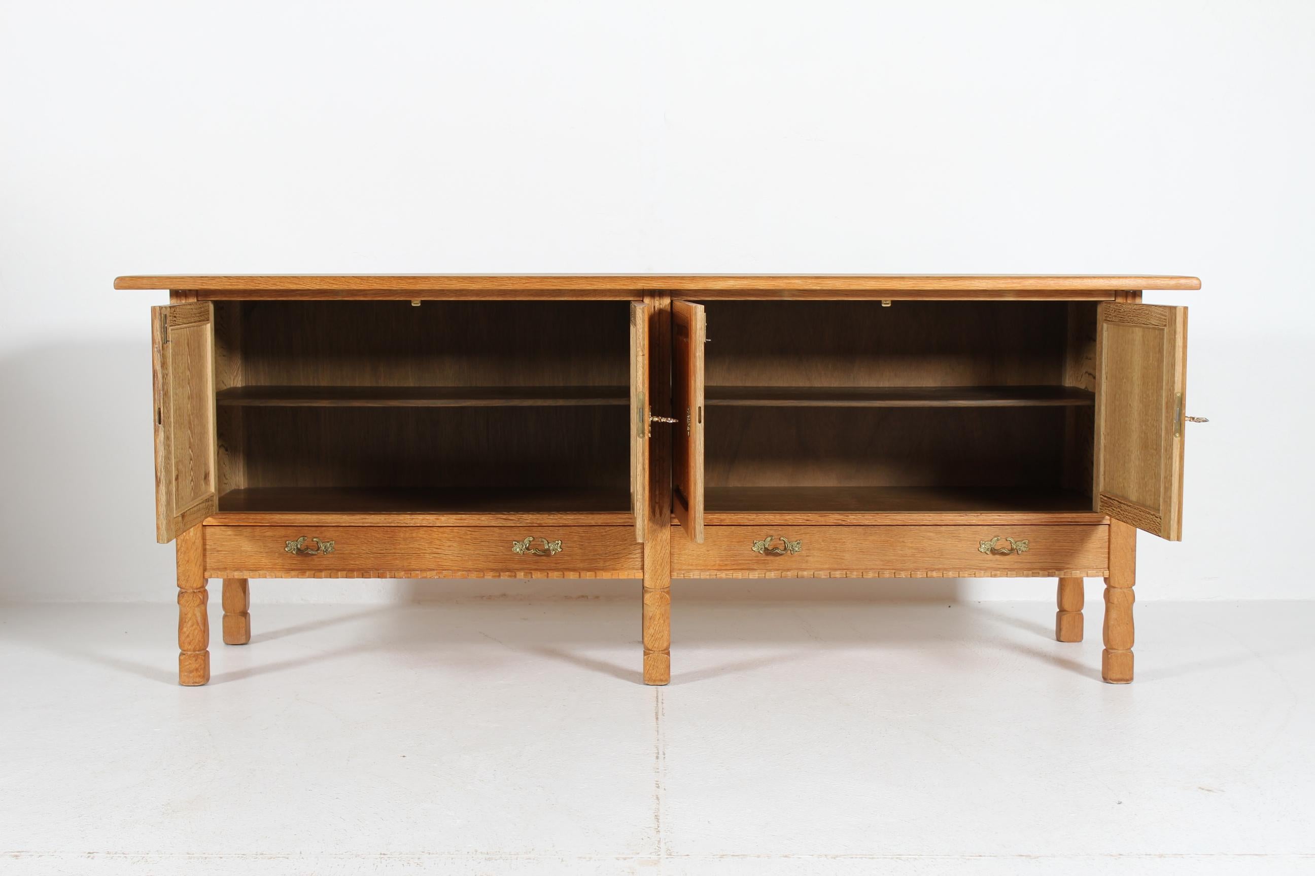 Danish Henning Kjærnulf style Long Sideboard of Oak with 4 Doors Brutalist 1970s For Sale 1