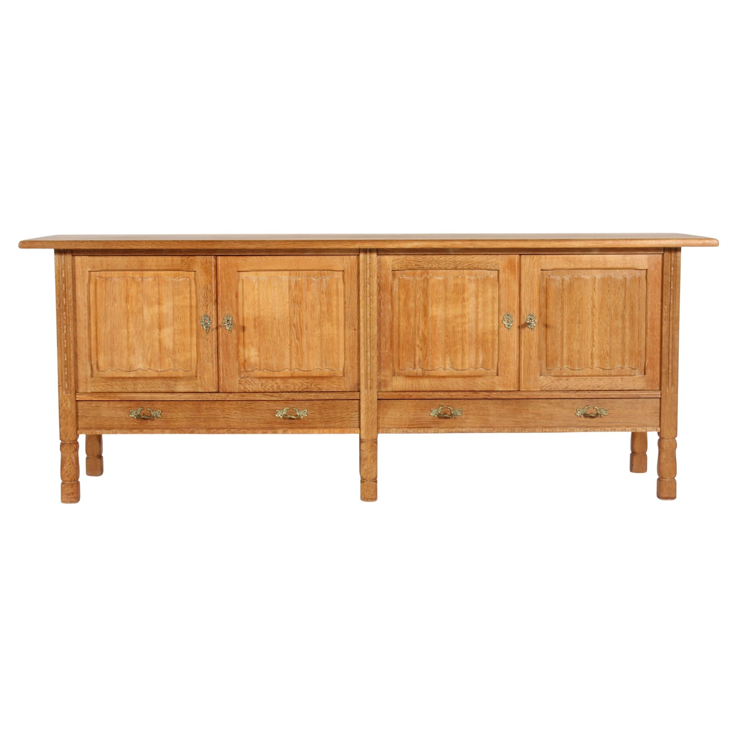 Danish Henning Kjærnulf style Long Sideboard of Oak with 4 Doors Brutalist 1970s For Sale