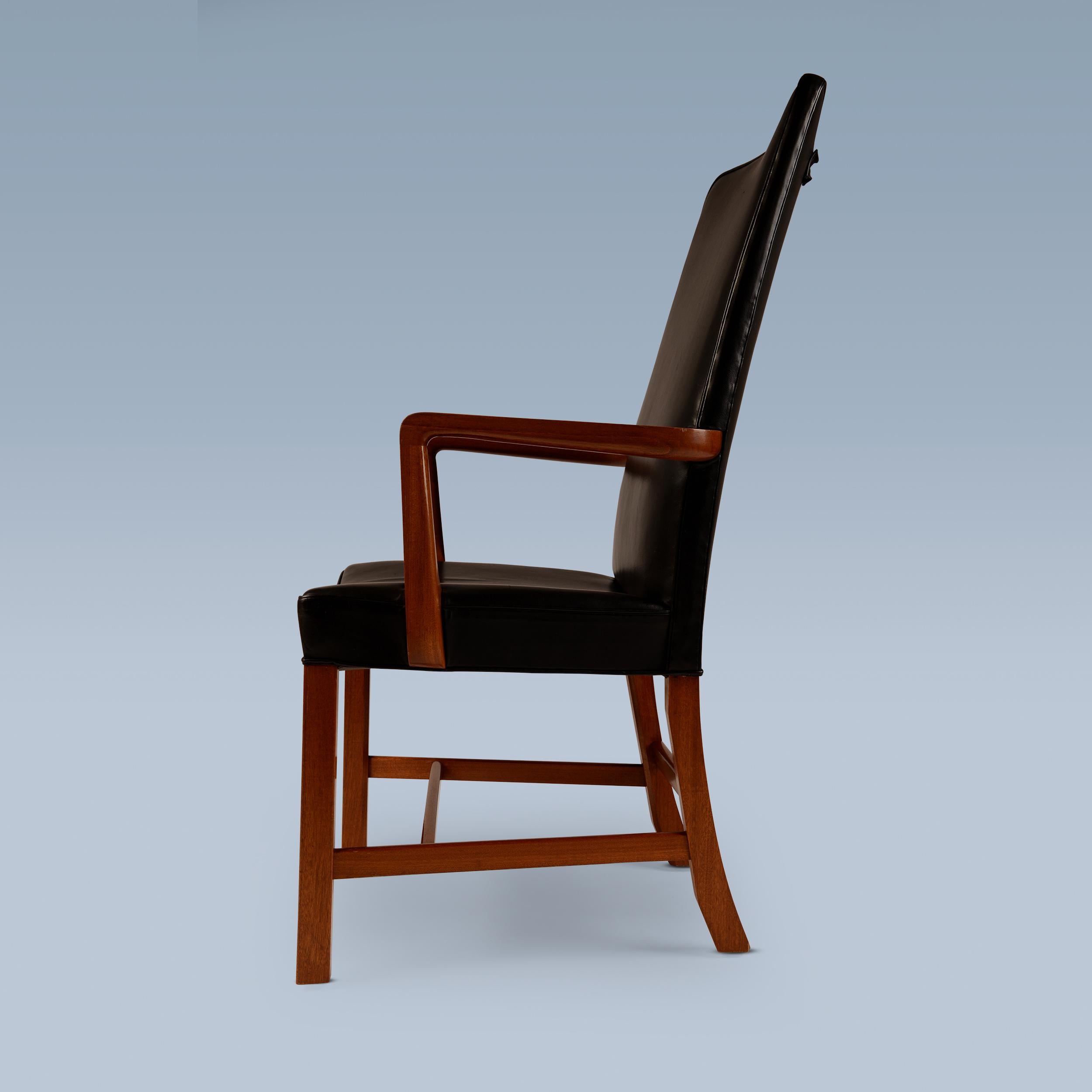 Scandinavian Modern Danish high back black leather armchair with mahogany frame For Sale