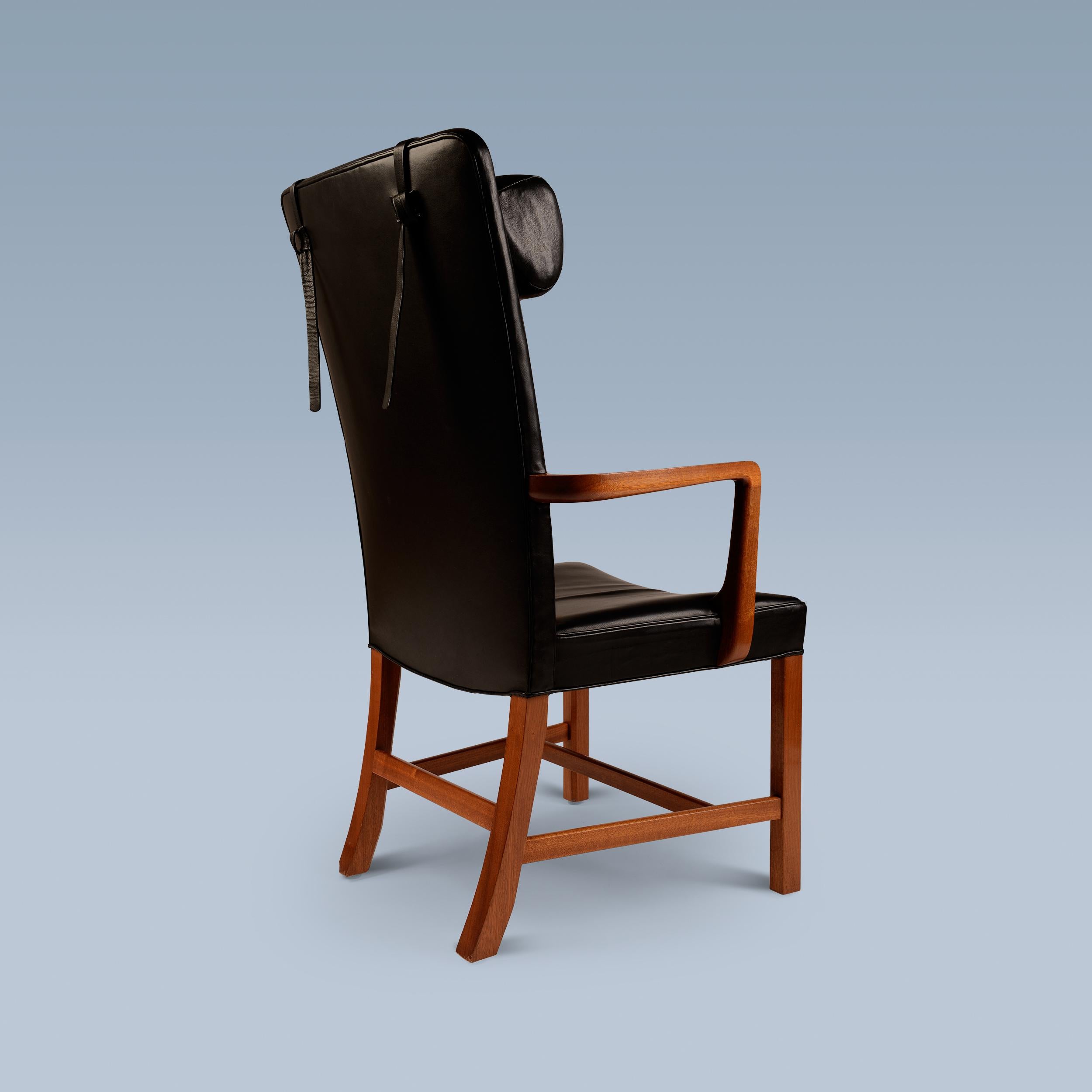 Mid-20th Century Danish high back black leather armchair with mahogany frame For Sale