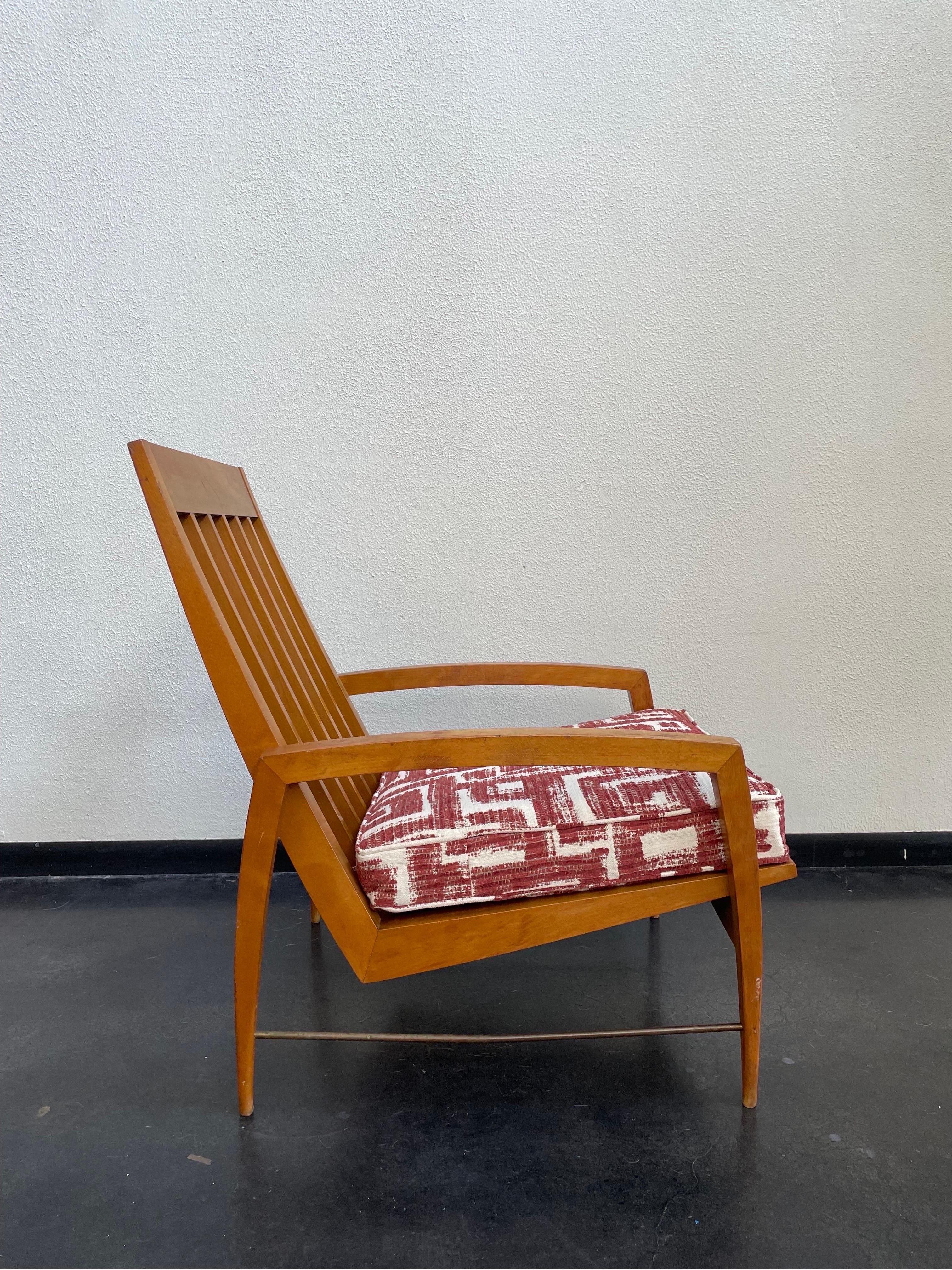 1960’s Danish modern high-back lounge chair featuring a beautifully carved walnut wood frame with 5 slats accentuating the back. With a new upholstered cushion.