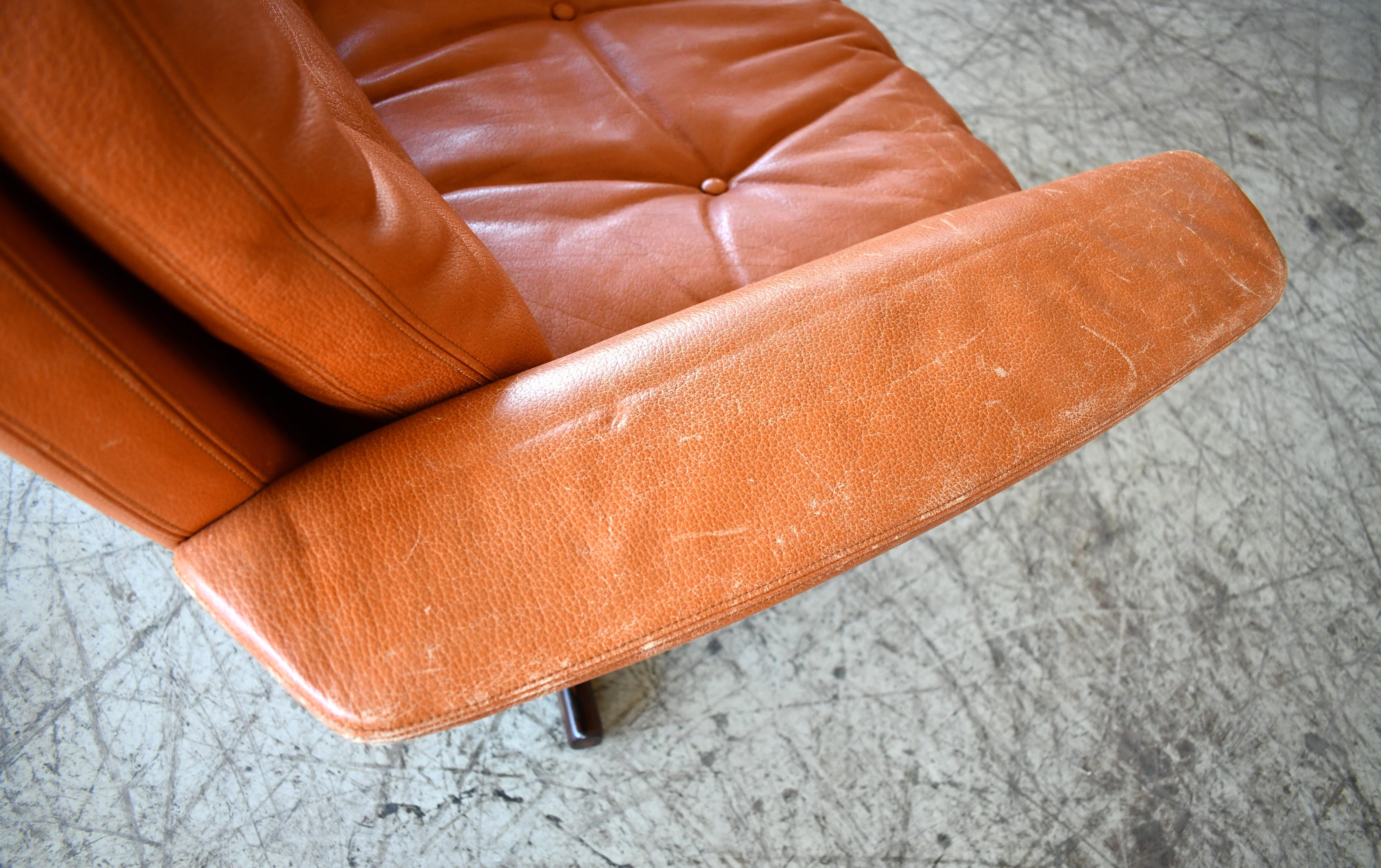 Danish High Back Swivel Lounge Chair with Ottoman in Cognac Leather, 1970's For Sale 4