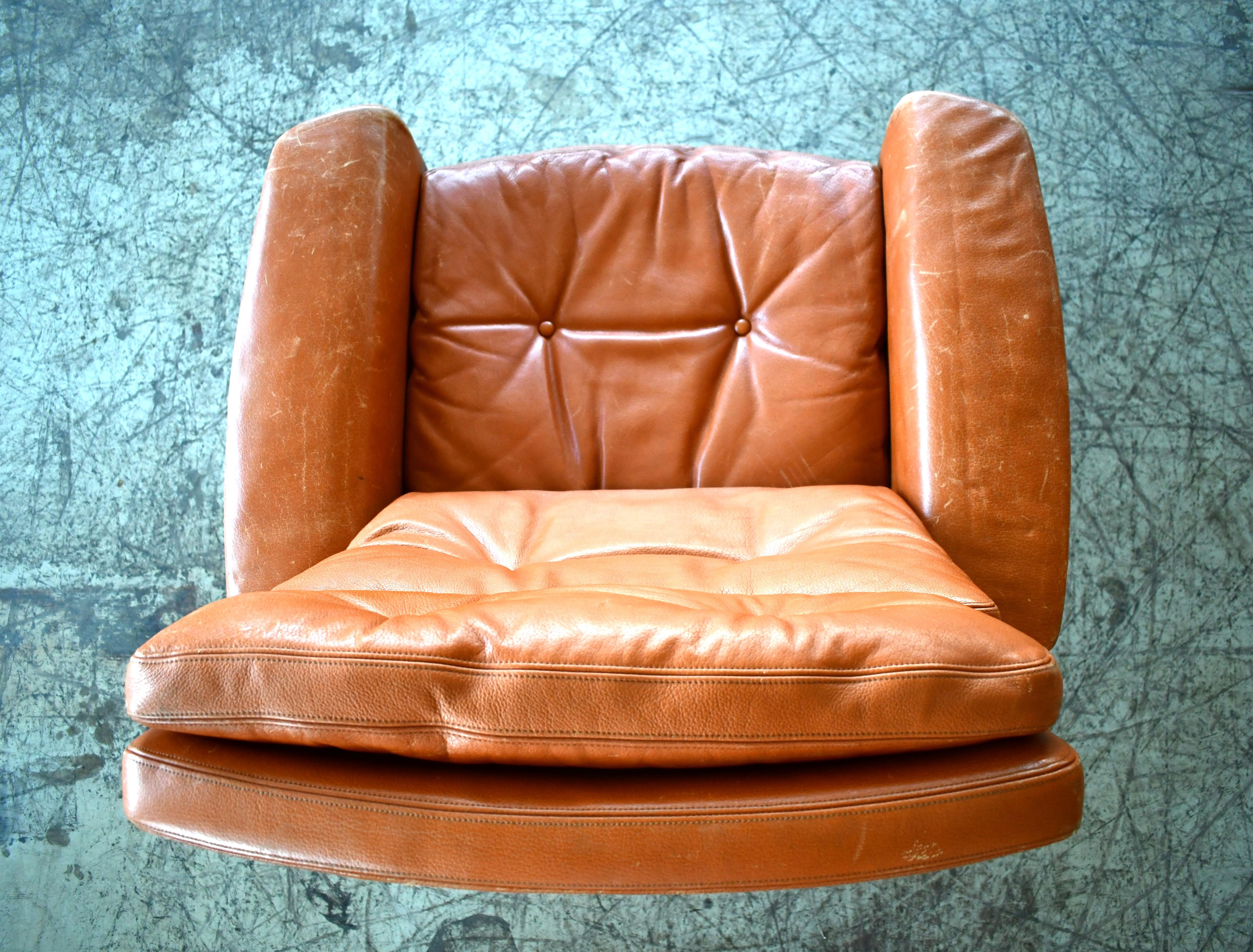 Danish High Back Swivel Lounge Chair with Ottoman in Cognac Leather, 1970's For Sale 3