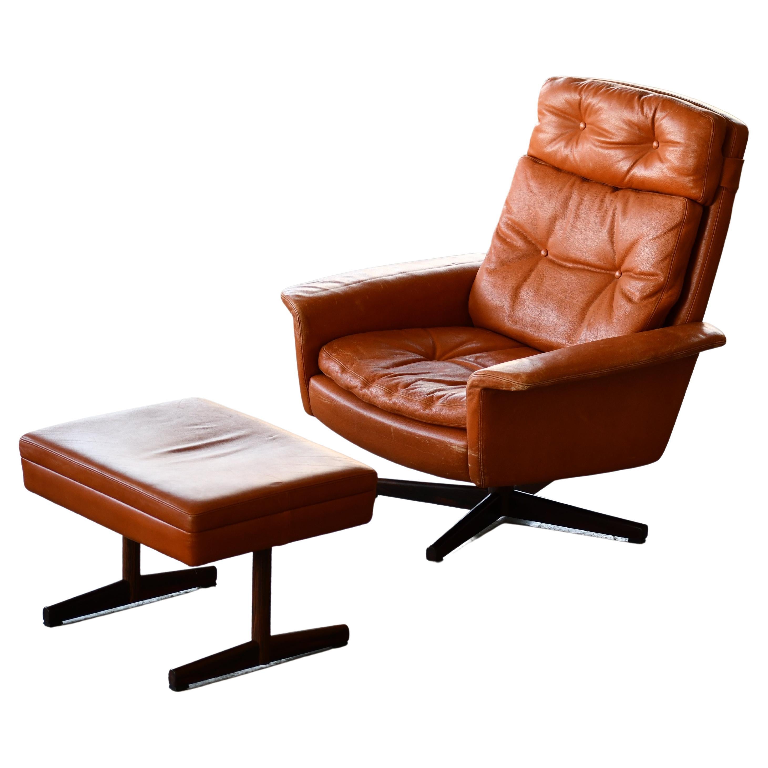 Danish High Back Swivel Lounge Chair with Ottoman in Cognac Leather, 1970's For Sale