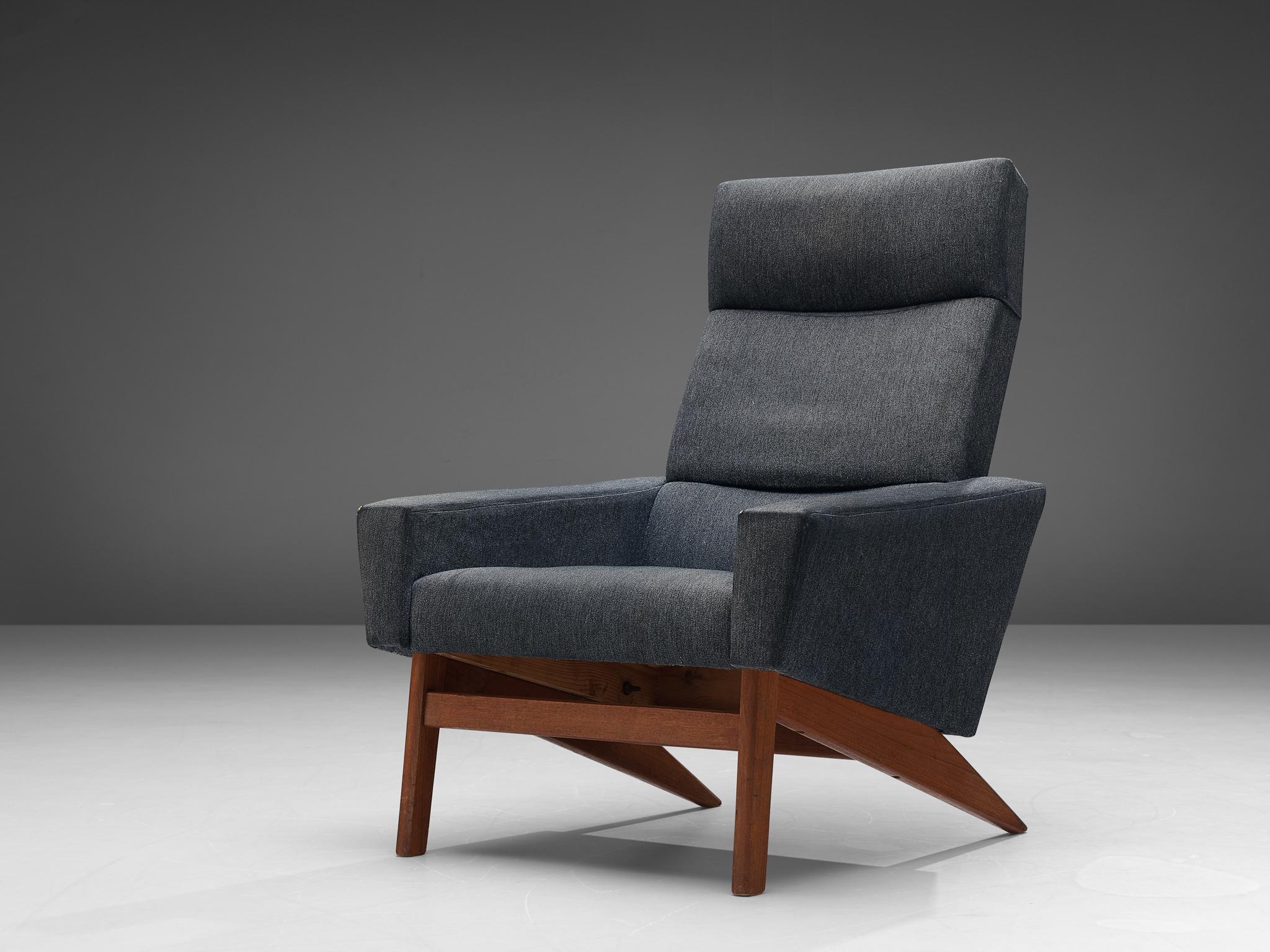 High back lounge chair, grey fabric upholstery, teak, Denmark, 1960s

Danish high back lounge chair in grey fabric upholstery. This comfortable chair features clean lines and comfortable upholstered seating. The sloping rectangular armrest are