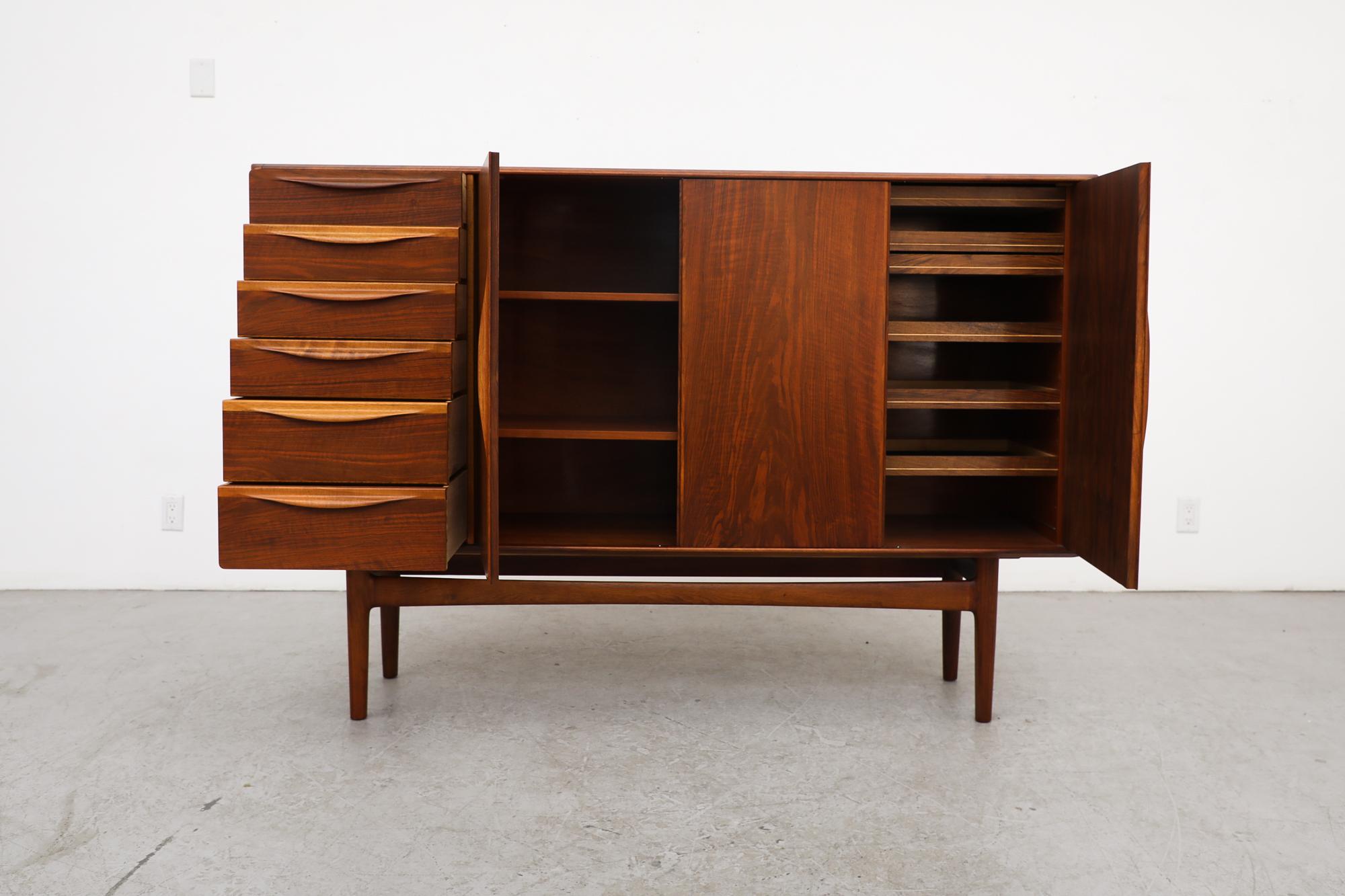 1960's Danish highboard by Henry Rosengren Hansen for Brande Mobelindustrie. Highboard is made from walnut, has side drawers and smaller drawers inside cabinet. In original condition with visible wear consistent with its age and use.