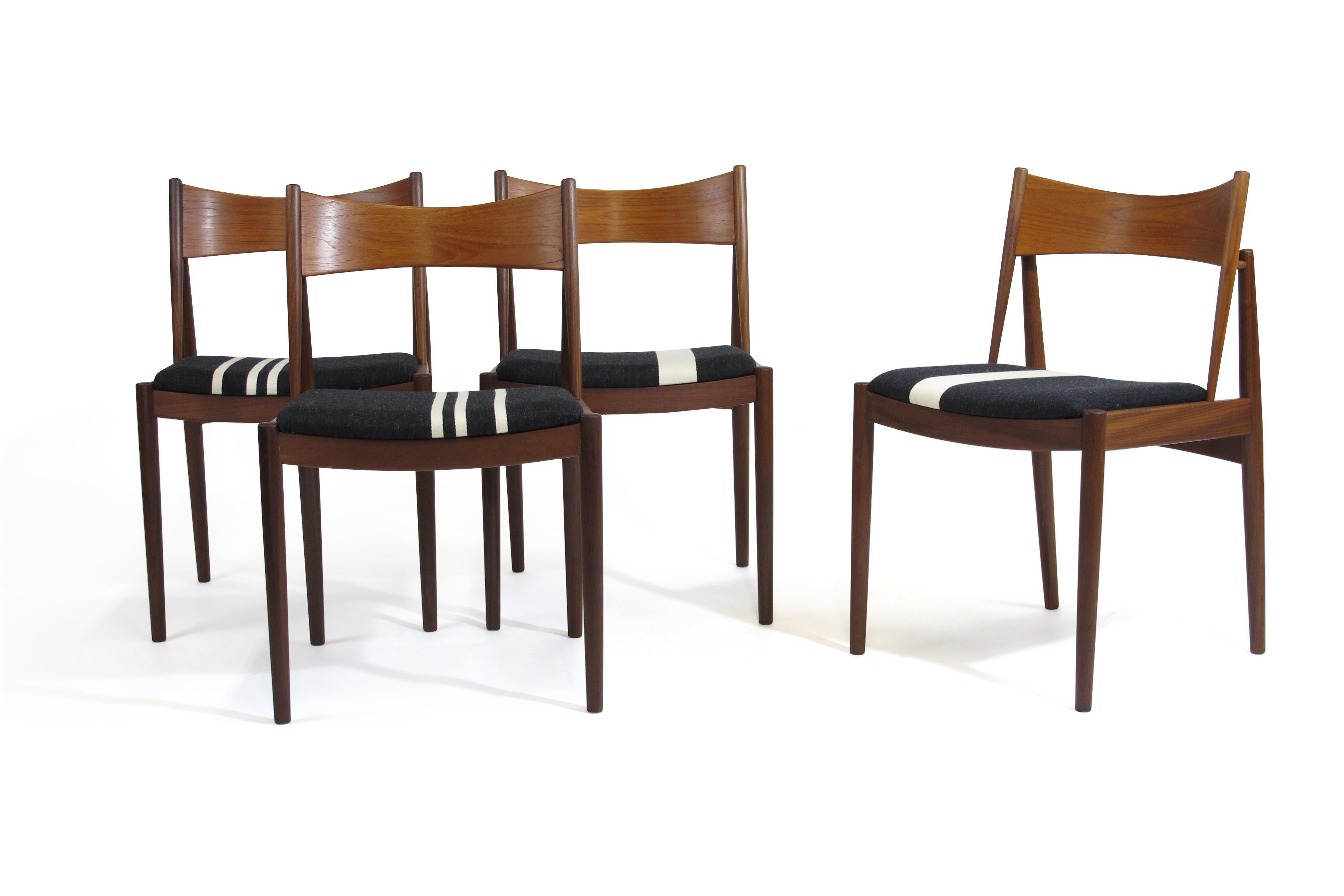 Sculptural dining chairs attributed to H.W. Klein. Teak frame with newly upholstered in bold graphic pattern. Set of four.