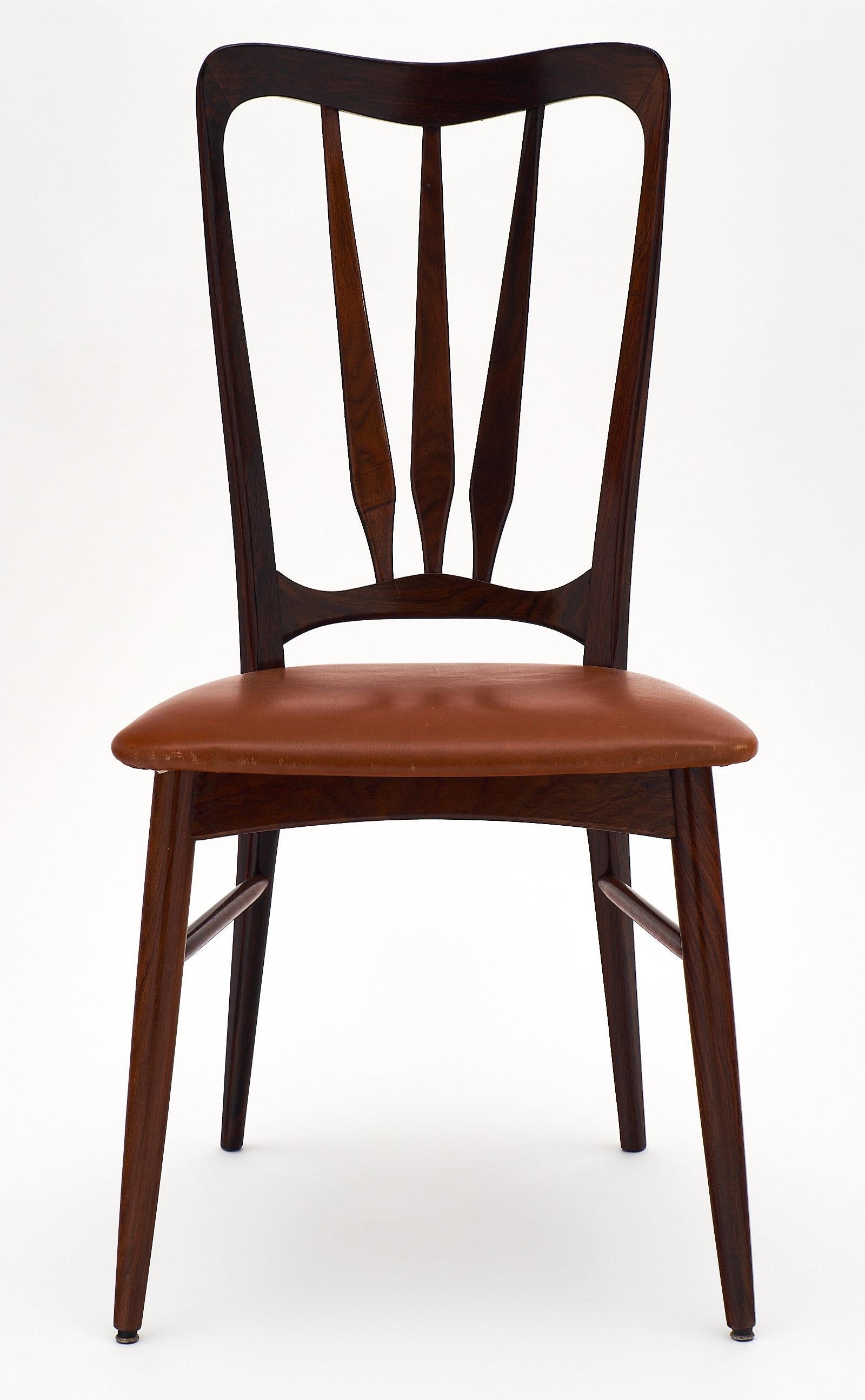 Set of six Danish “Ingrid” dining chairs designed by Niels Koefoed for Koefoed Hornslet. They have Danish control stamps and Koefoed stamps. We love the curved design and tall backs.