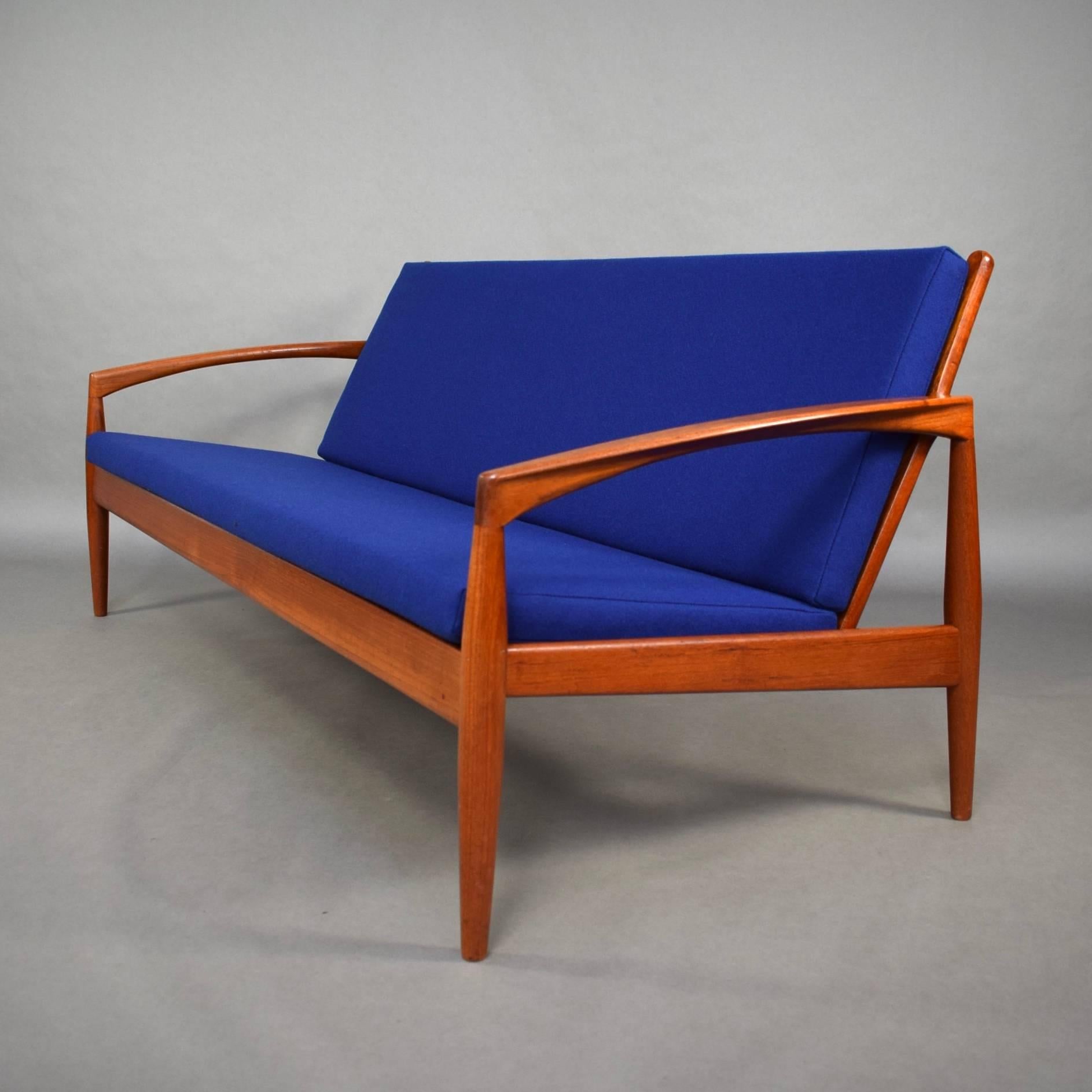 Elegant Paperknife sofa by Kai Kristiansen for Magnus Olesen - Denmark, 1960's. Excellent condition and reupholstered with a beautiful blue wool fabric (also new foam in the cushions). 

Designer: Kai Kristiansen

Manufacturer: Magnus
