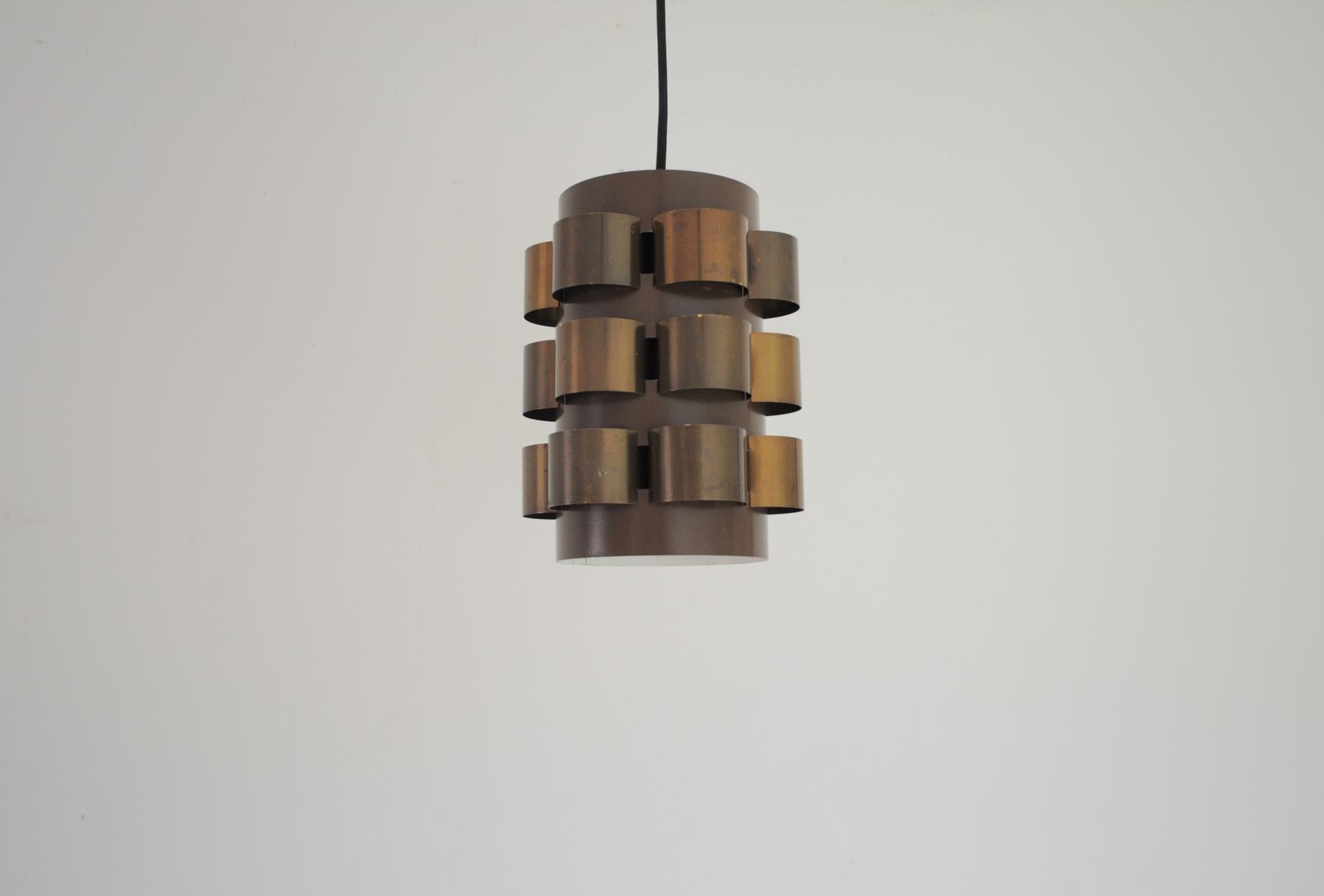Danish lamp with beautifully patinated brass elements, designed by Werner Schou and produced by Coronell in Denmark during the 1960s. The cylindrical brown shape of the lamp casts warm light. It features a fine brass E27 bulb holder.

Signs of