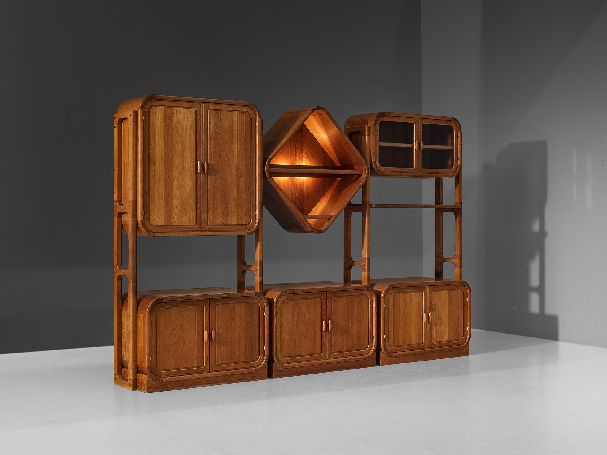 Cupboard or bookcase, teak, glass, Denmark, 1970s

This cabinet of Danish origin is based on an elongated construction of three columns, offering a variety of different storage possibilities. A sophisticated composition is created by the arrangement