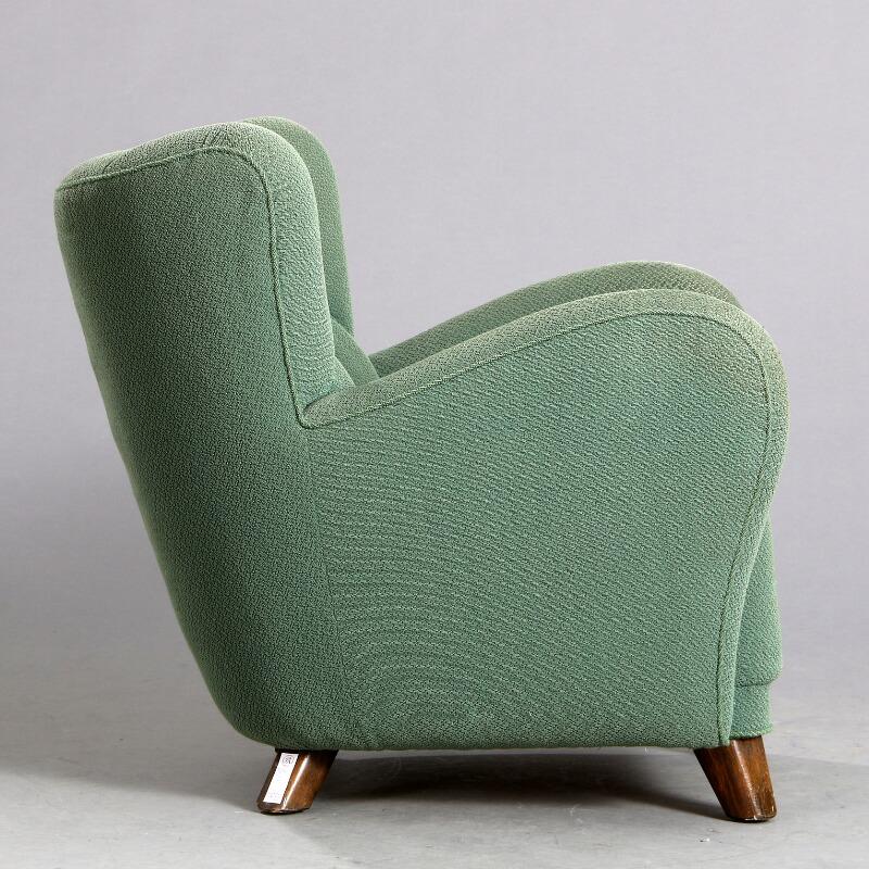 Danish large-scale 1940s club chair with channeled back upholstery.