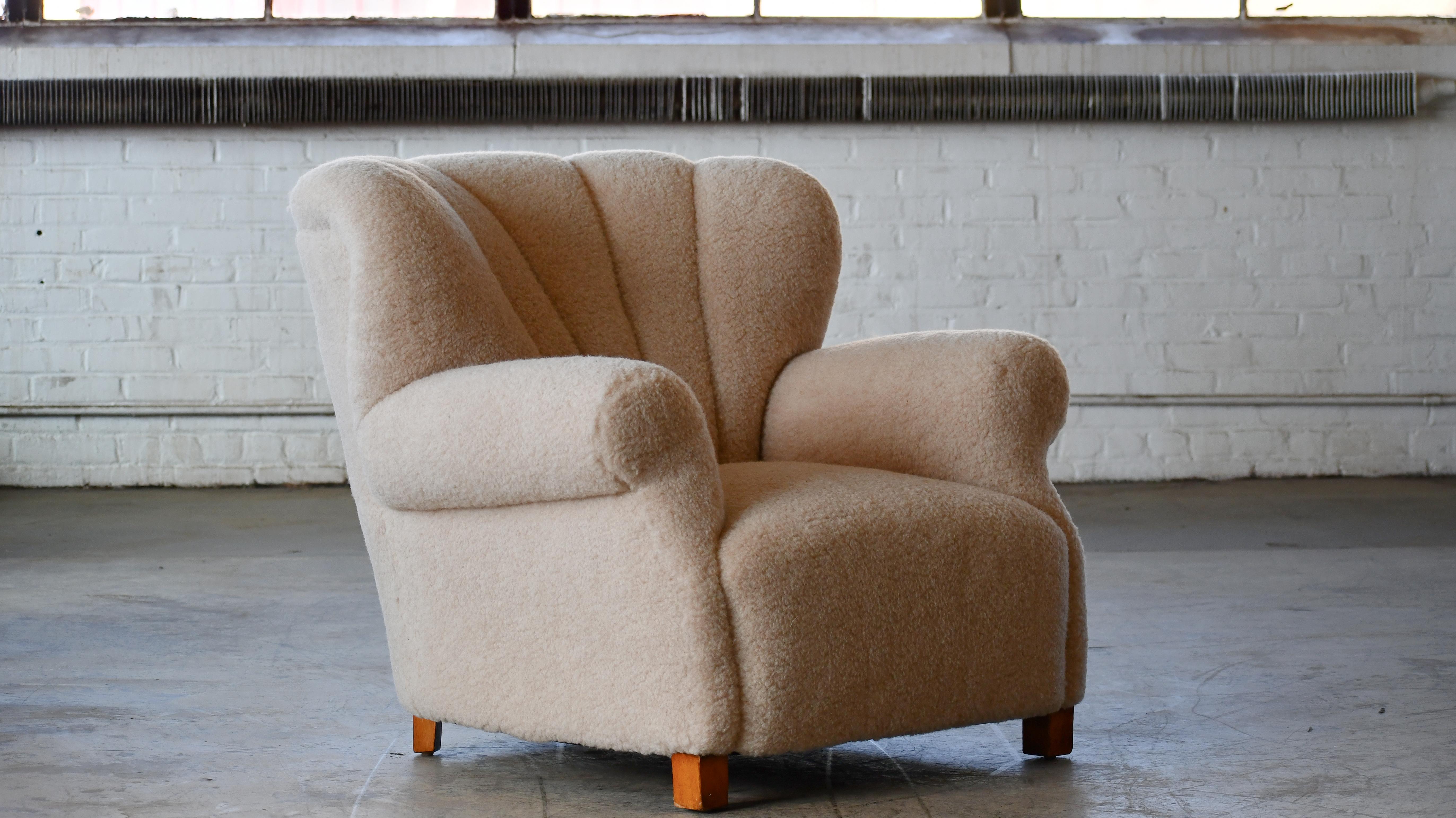 Sublime large club chair model 1518 club chair made by Fritz Hansen in the late 1930s or early 1940s. This model came in two heights - this being the lower back model. Superbly comfortable the chair with its dramatically low and wide proportions has