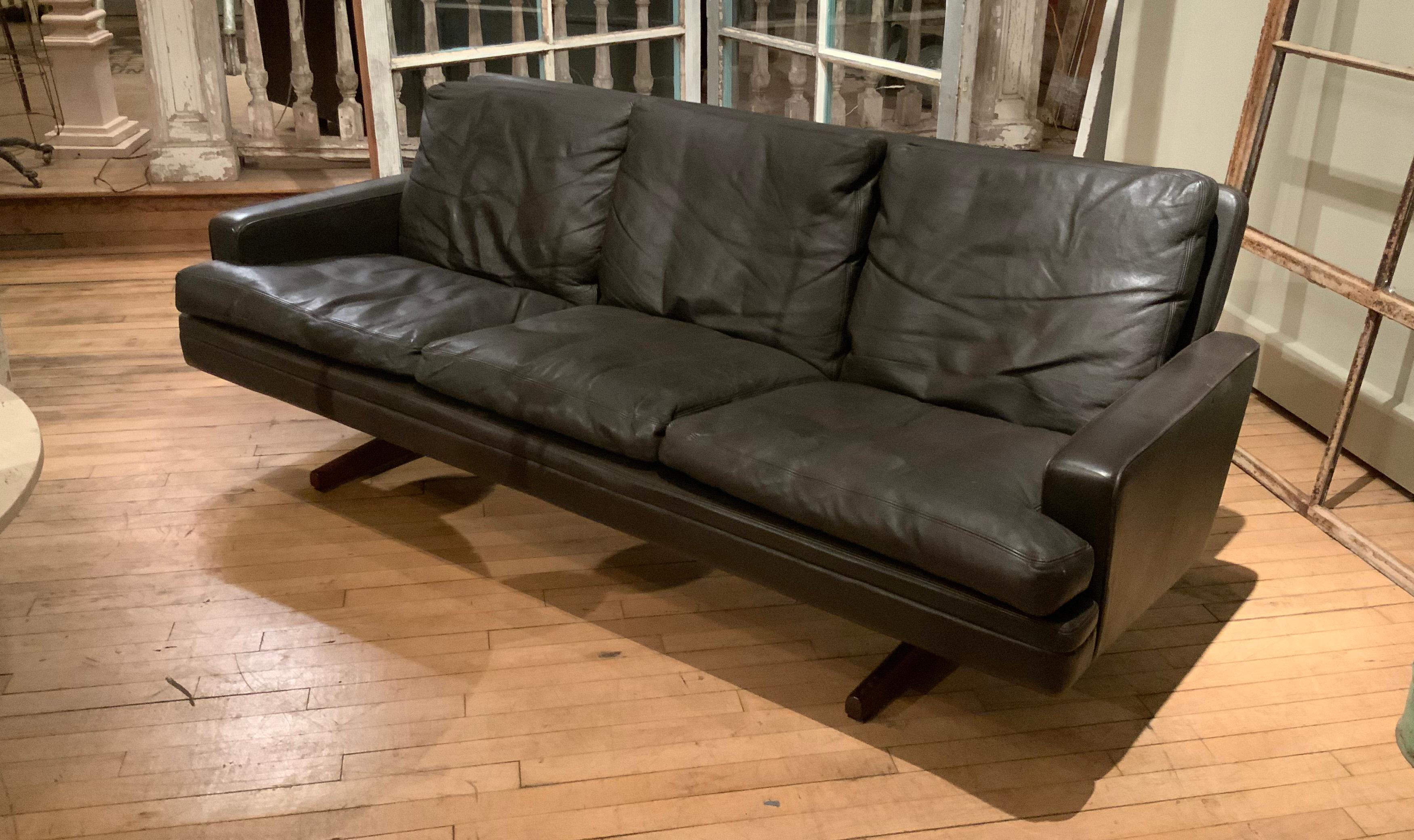 A 1960s three-seat sofa in dark brown leather and rosewood by Fredrik Kayser made by Vatne Mobler. Beautiful design and original leather with wonderful patina and down cushions.