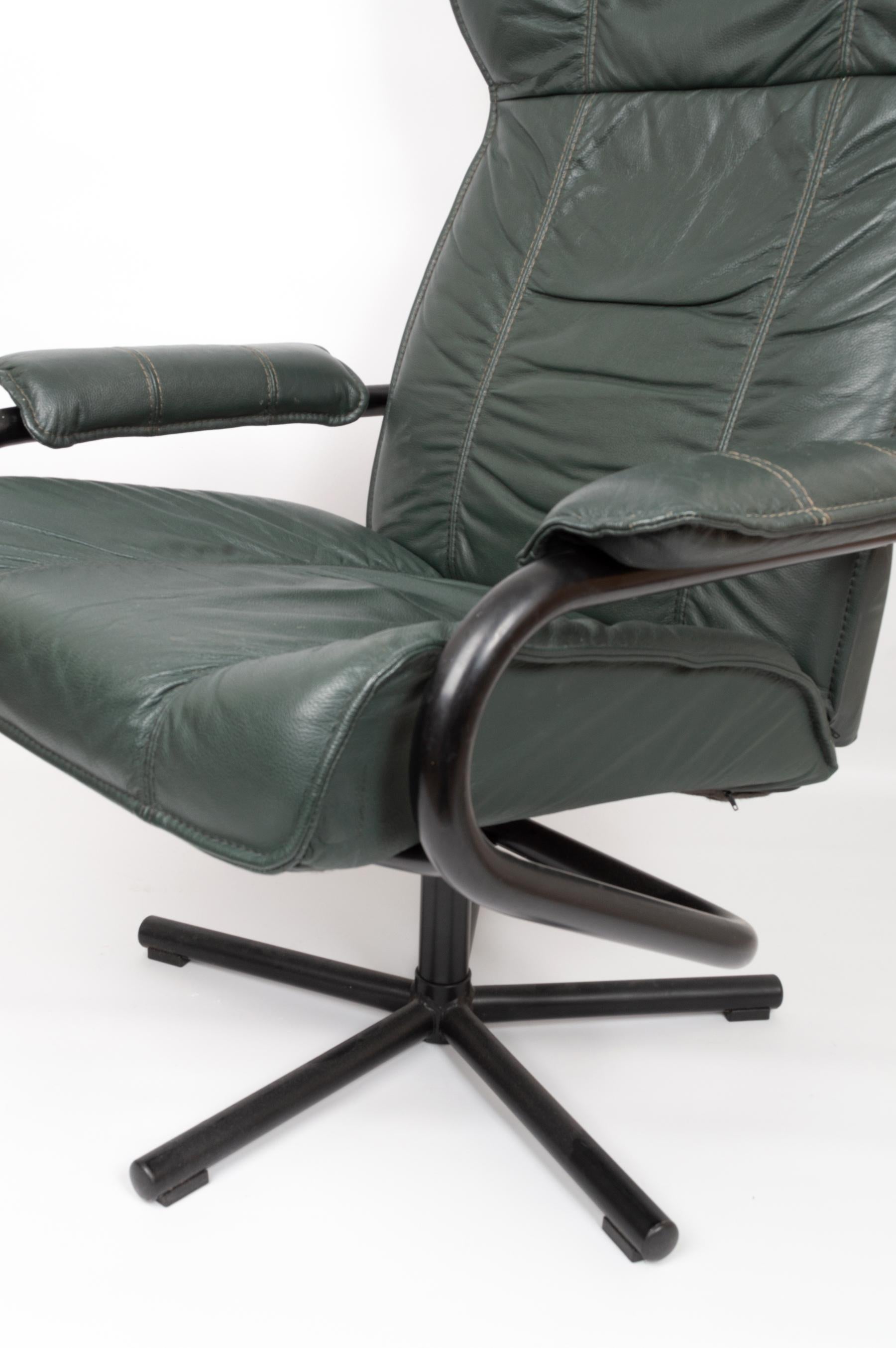 Danish leather reclining swivel lounge chair by Kebe Denmark, circa 1970.

Racing green leather upholstery. 
Presented in excellently preserved condition. The chair both swivels and reclines, with the mechanism remaining in good working order.
