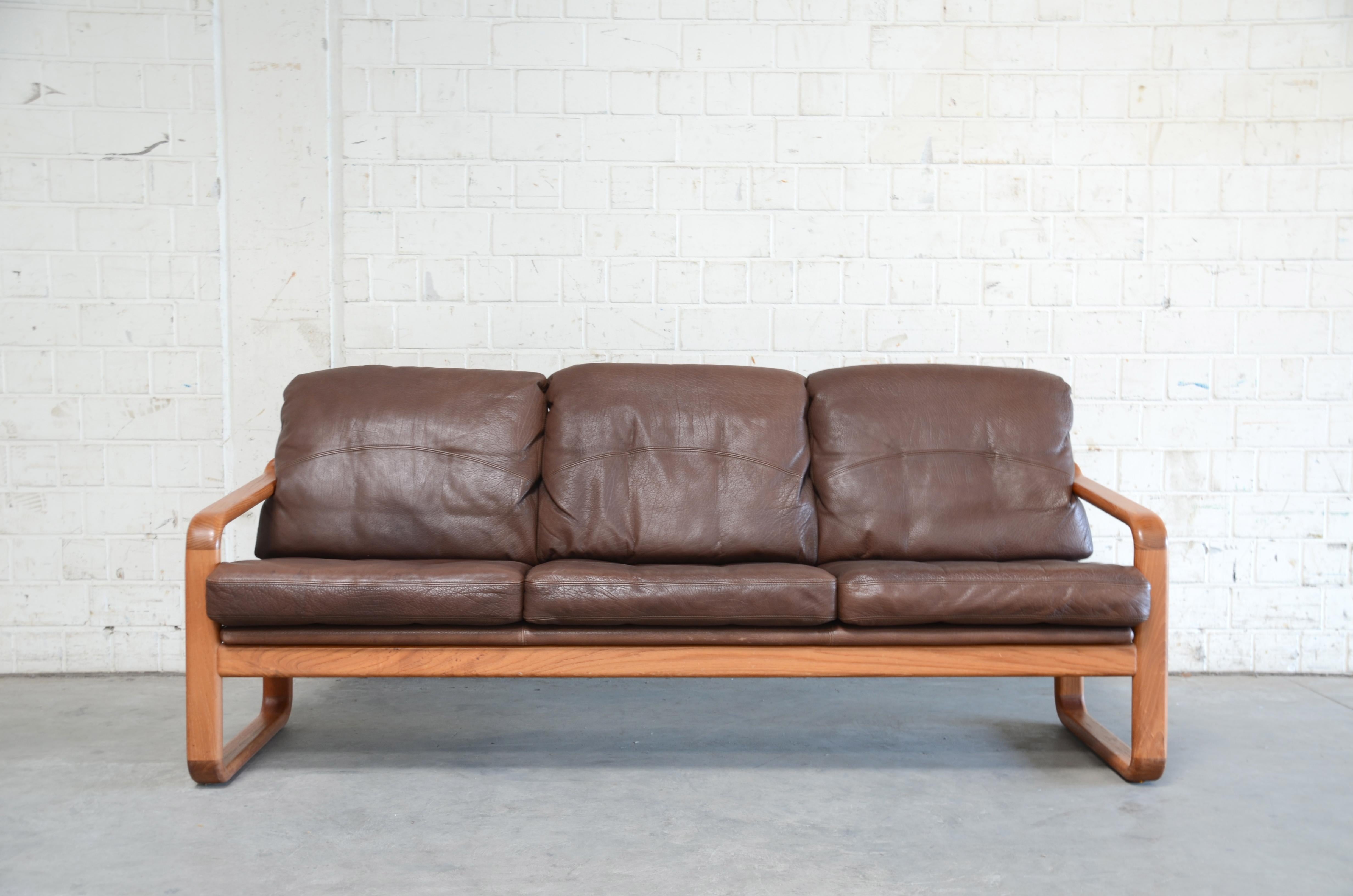 Danish leather sofa from Holstebro Mobelfabrik.
Thick brown aniline leather and solid teak frame.