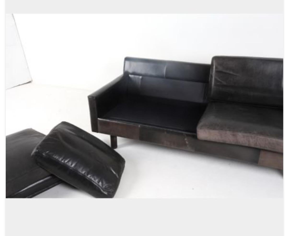 Leather Danish modern sofa with beech legs. A gorgeous representation from the midcentruy modern era. Please reference photos for indoor and outdoor shots to best capture the piece.