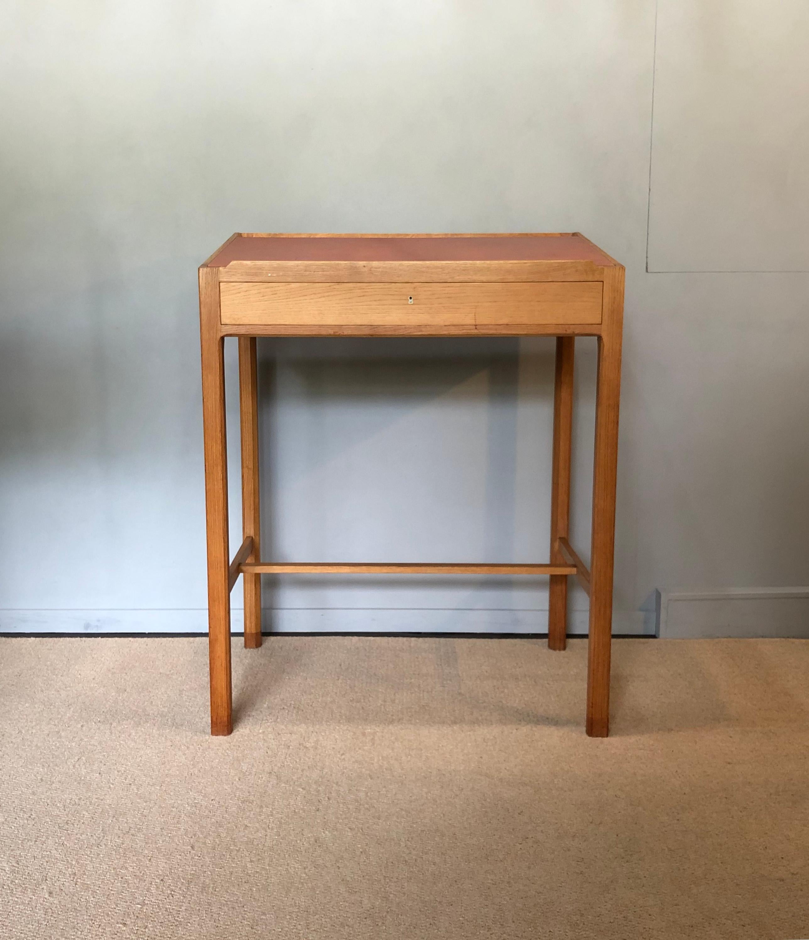 A superb standing writing lectern desk. Constructed from quartersawn European oak with original leather surface. Lockable drawer with key. The leather can be replaced by us upon request - several colours available. This Standing Desk would be