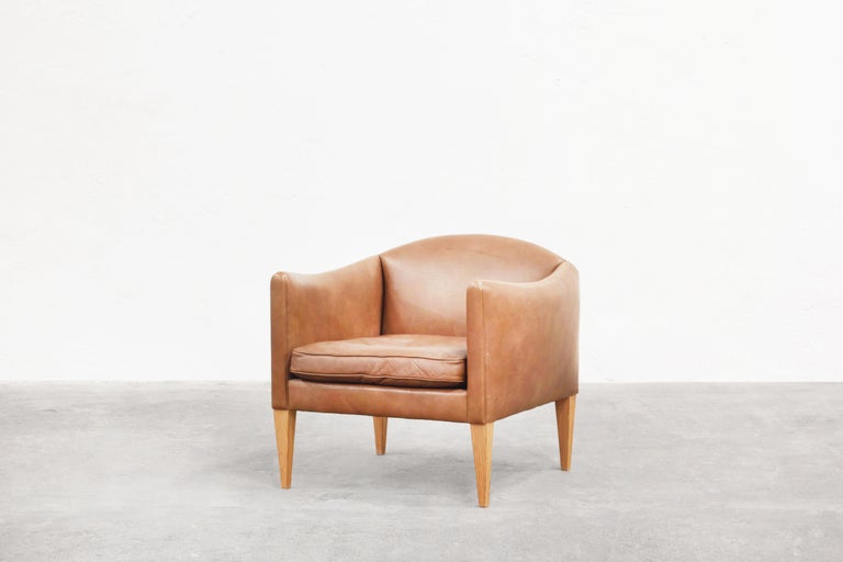 Very beautiful lounge chair designed by Illum Wikkelsø and produced by Holger Christiansen in the 1960s in Denmark.
The lounge chair comes with a beautifully patinated brown leather with traces of usage. It is ready for usage.


